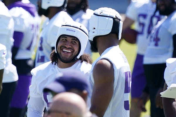 Minnesota Vikings middle linebacker Eric Kendricks (54) joked with outside linebacker Anthony Barr (55) during the first day of mandatory minicamp Tue