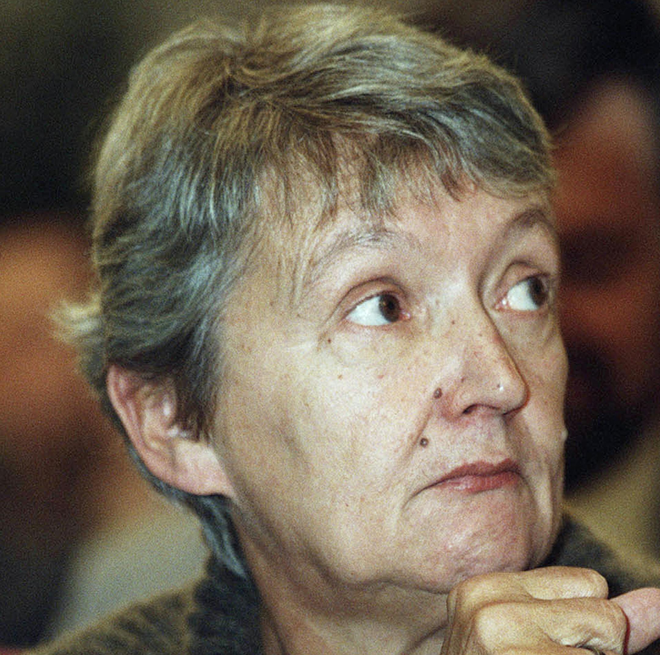 FILE - In this Nov. 10, 1998 file photo, Austrian writer Christine Noestlinger sits prior to being awarded with the Astrid Lindgren children's literature prize with U.S. writer Maurice Sendak. Noestlinger, an Austrian author best known for her children’s books such as “Fiery Frederica” and “Fly Away Home,” has died at the age of 81. The Residenz publishing house in Vienna said on Friday, July 13, 2018 that Noestlinger died June 28 after a short illness. (AP Pho