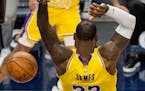 LeBron James of the Lakers dunked the ball in the first quarter Tuesday night at Target Center.