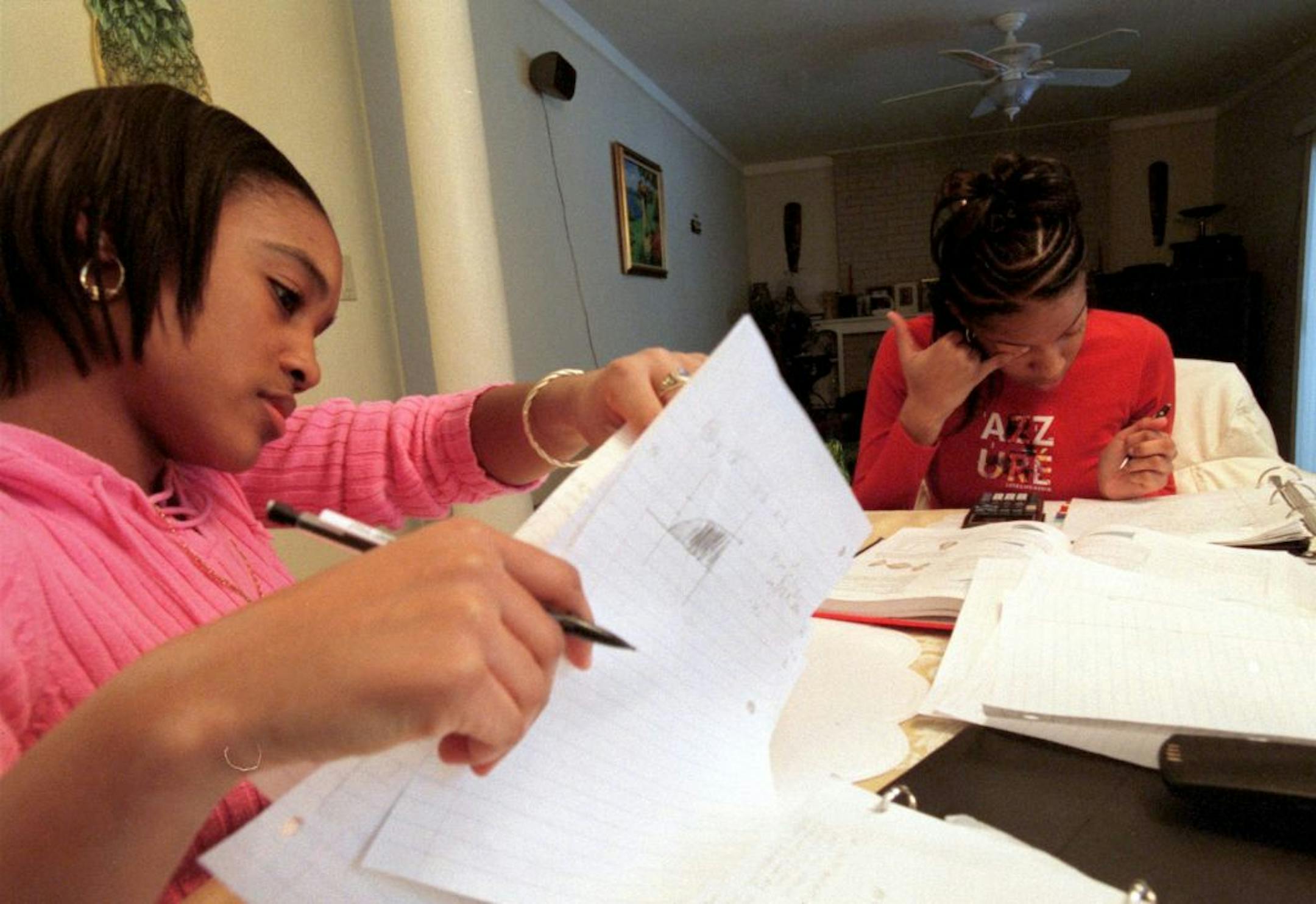 Sharolyn Wynter, 18, studied for an AP calculus quiz with her friend Calicia Johnson, 17, in Wynter's home in Southfield, Mich.