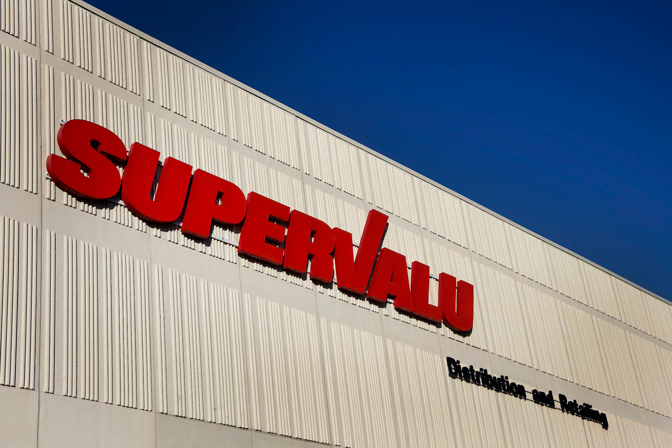 The Supervalu Inc. logo is displayed at a distribution center in Hopkins, Minnesota on Monday, Jan. 9, 2012. Inventories at U.S. wholesalers rose 0.1 percent following a 1.2 percent revised gain in October, Commerce Department figures showed today in Washington. Photographer: Ariana Lindquist/Bloomberg