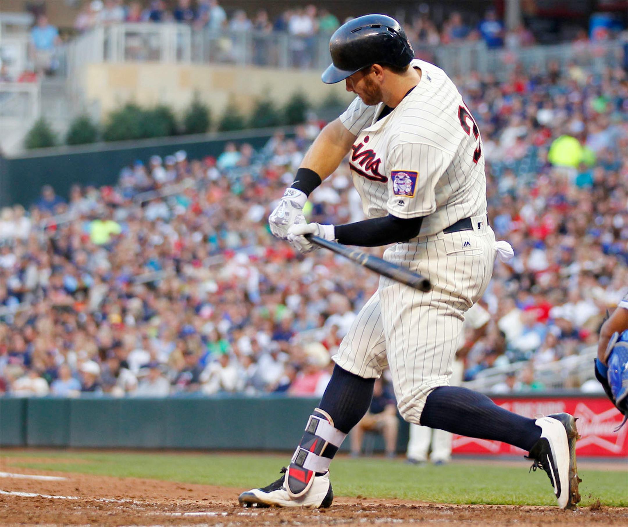 Minnesota Twins' Robbie Grossman swings into a home run against the Kansas City Royals in the fifth inning during a baseball game on Saturday, Aug., 13, 2016, in Minneapolis.