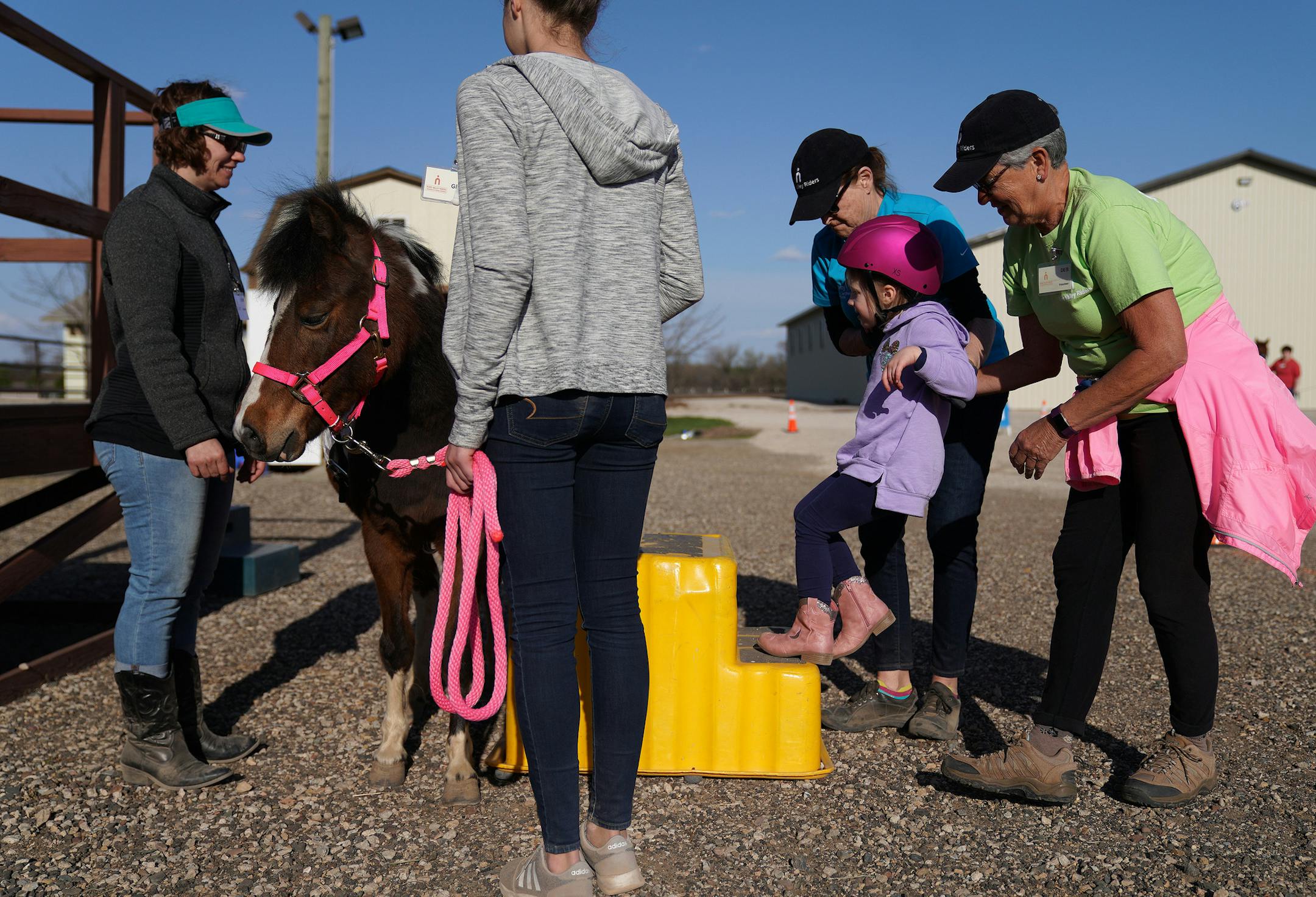 Maren Haugen, 4, got some help as she climbed atop Daisy for the Emerging Independent class Thursday at the River Valley Riders' facility in Afton. ] ANTHONY SOUFFLE &#x2022; anthony.souffle@startribune.com Students participated in equine programs Thursday, April 25, 2019 at the River Valley Riders equine therapy center in Afton, Minn. After nearly 20 years of hauling donated horses to fairgrounds or private barns for lessons the River Valley Riders have begun building their own facility near Af