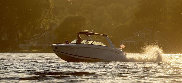 Boaters took to the water as the sun set on Lake Minnetonka Tuesday, July 2, 2019 in Excelsior, MN. Hennepin County epidemiologists were continuing to