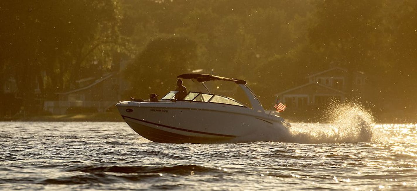 Boaters took to the water as the sun set on Lake Minnetonka Tuesday, July 2, 2019 in Excelsior, MN. Hennepin County epidemiologists were continuing to investigate reports that a number of people who were boating around Big Island on Lake Minnetonka got sick over the July 4th weekend.