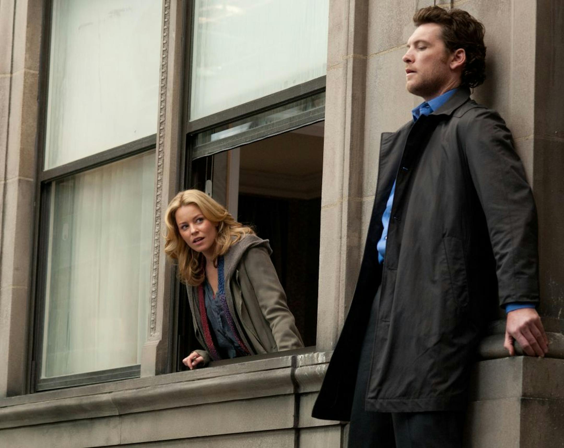 In this film image released by Summit Entertainment, Elizabeth Banks, left, and Sam Worthington are shown in a scene from "Man on a Ledge."