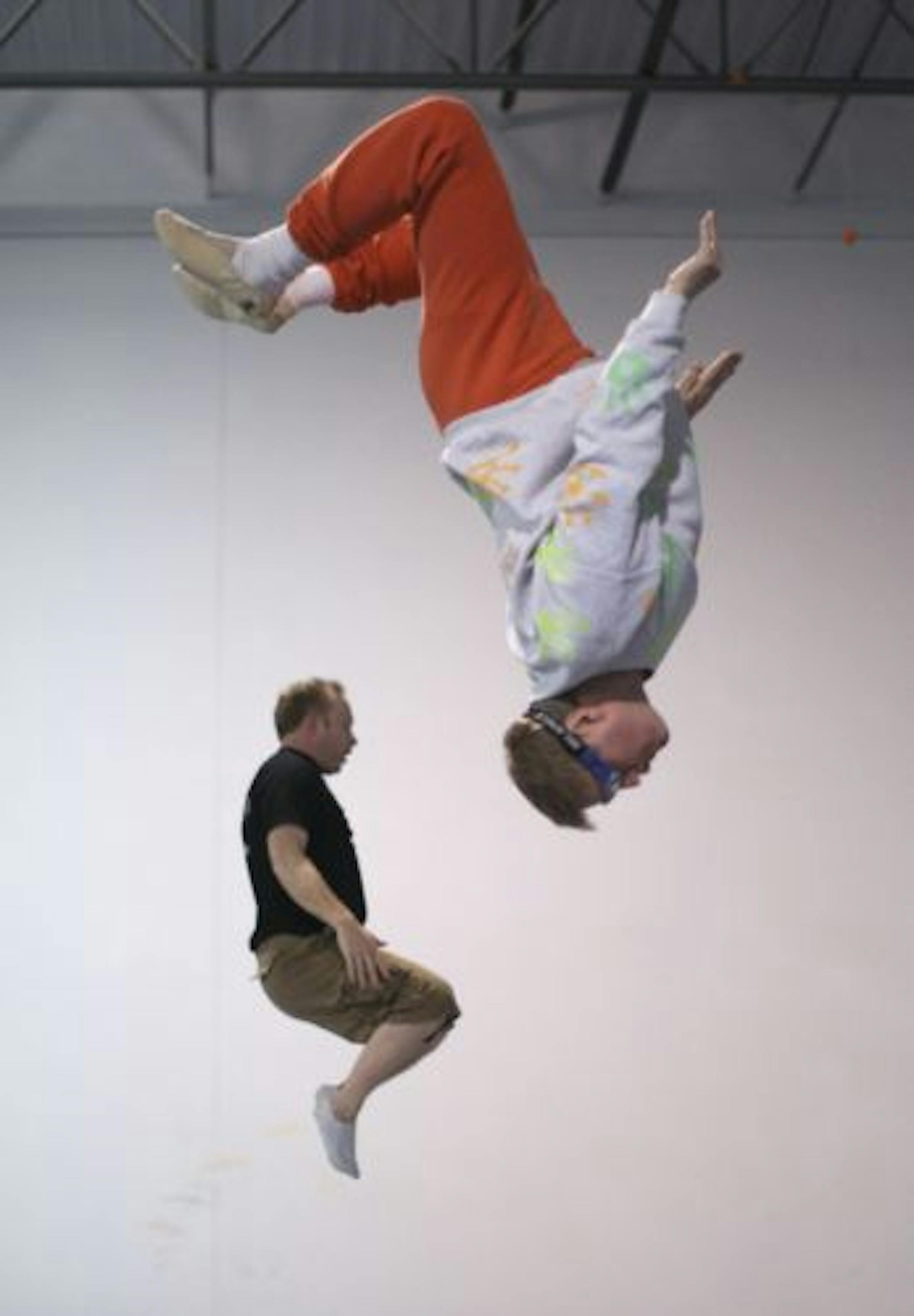 Paul Armour, 63, foreground, and Andy Morgan, 42, worked out during a recent adult trampoline class at Gleason's Gymnastics School in Eagan.