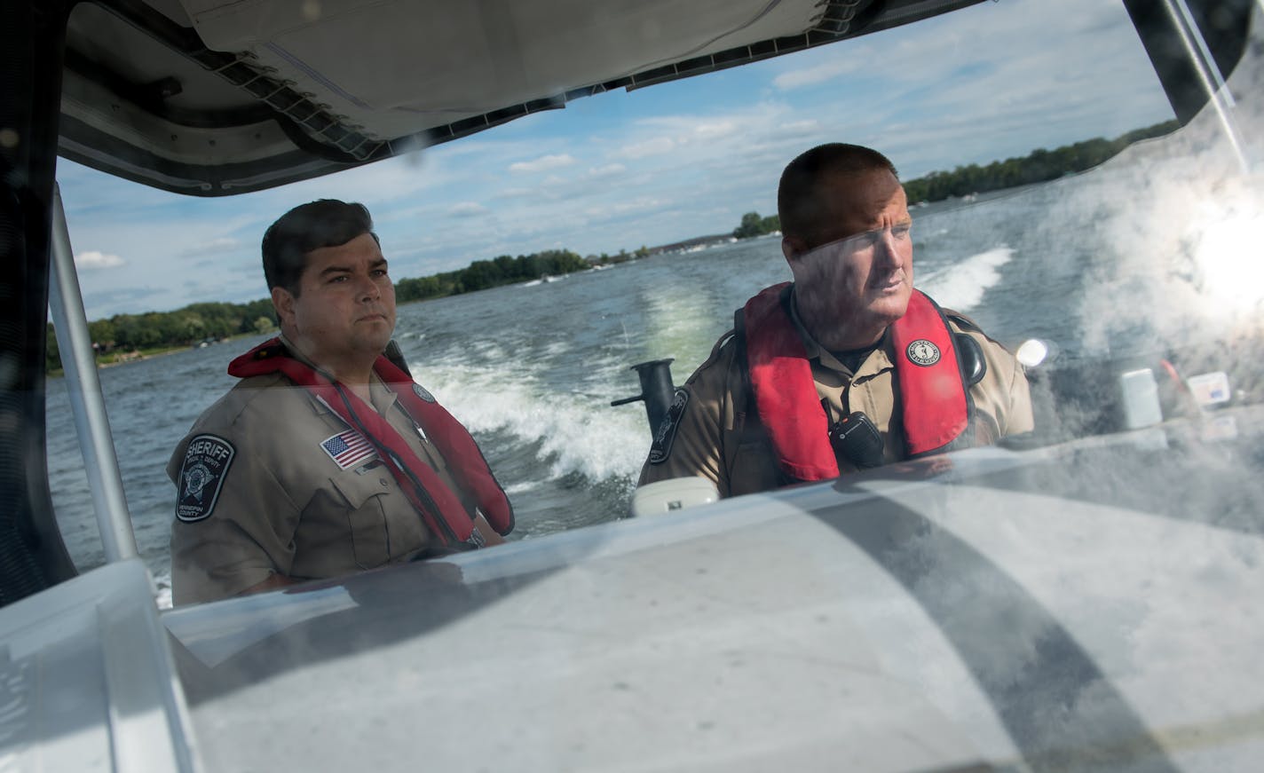 Hennepin County Sheriff's Office special deputy Amir Gharbi, left, and deputy Jeremy Gunia patrolled Lake Minnetonka Saturday afternoon. ] (AARON LAVINSKY/STAR TRIBUNE) aaron.lavinsky@startribune.com We do a ride along with the Hennepin County Sheriff's Office Water Patrol, one of the largest such patrols in the country, as deputies patrol Lake Minnetonka on the final big boating weekend of the season. It's already been a deadly year on the Twin Cities' largest lake, with three deaths -- up from