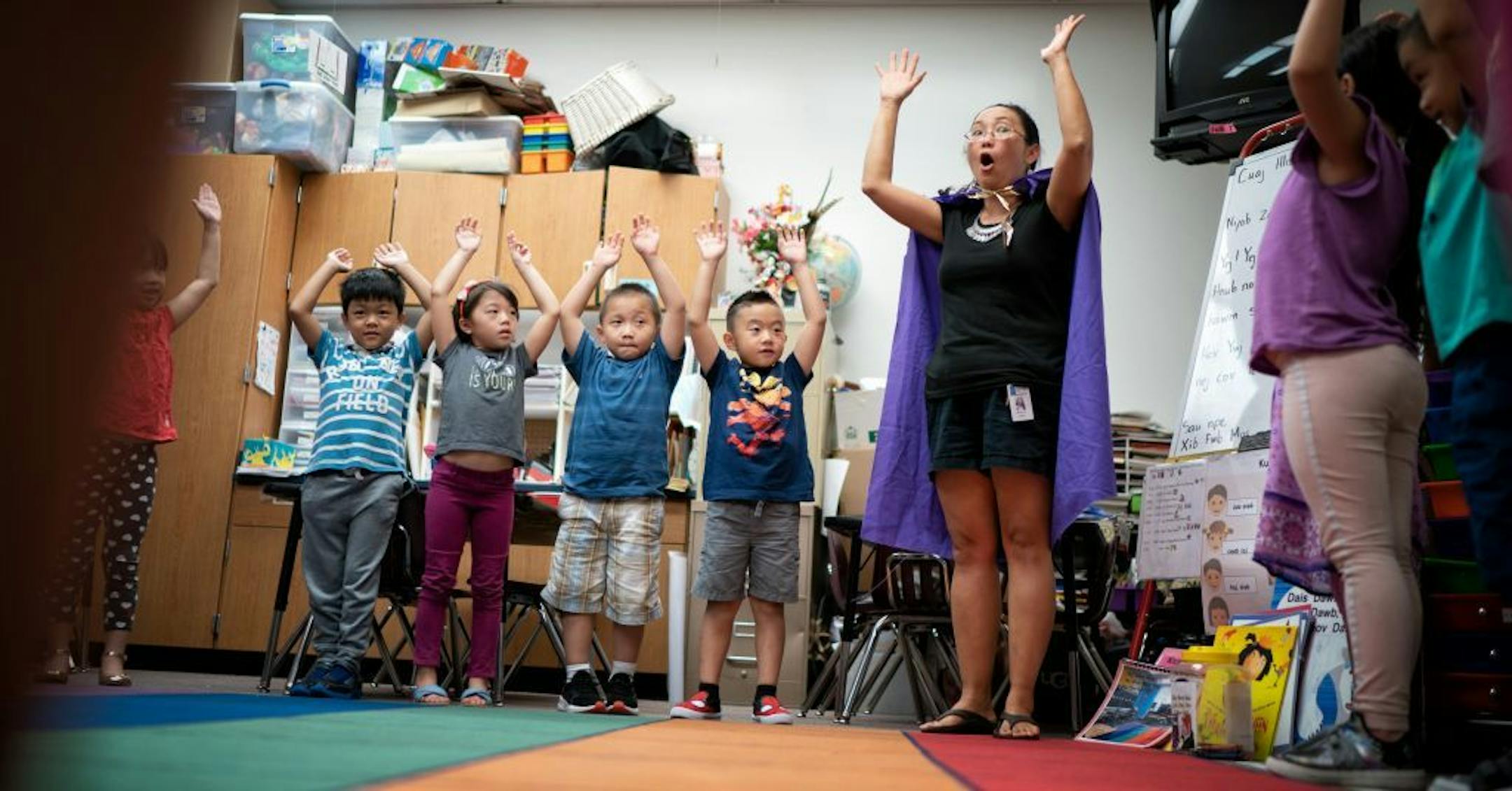 First-grade teacher Moslais Xiong played a game to help her class focus on listening at Phalen Lake Hmong Studies Magnet in St. Paul.