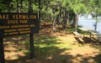 A sign welcomes visitors to the day-use area at Armstrong Bay in Minnesota's new Lake Vermilion State Park. The area is accessible only by boat, but a