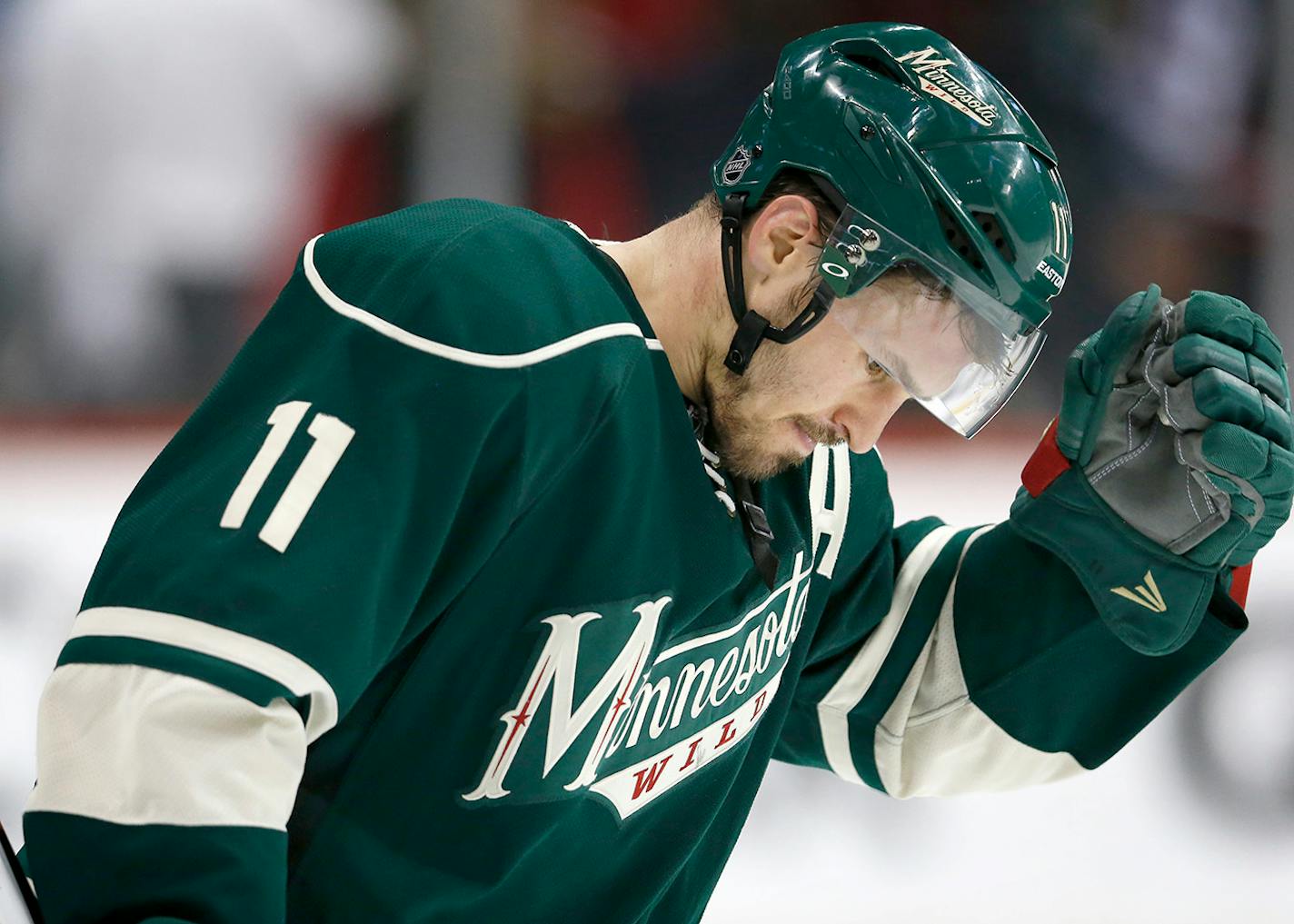 Zach Parise (11) skated off the ice at the end of the game. Chicago beat Minnesota by a final score of 1-0.