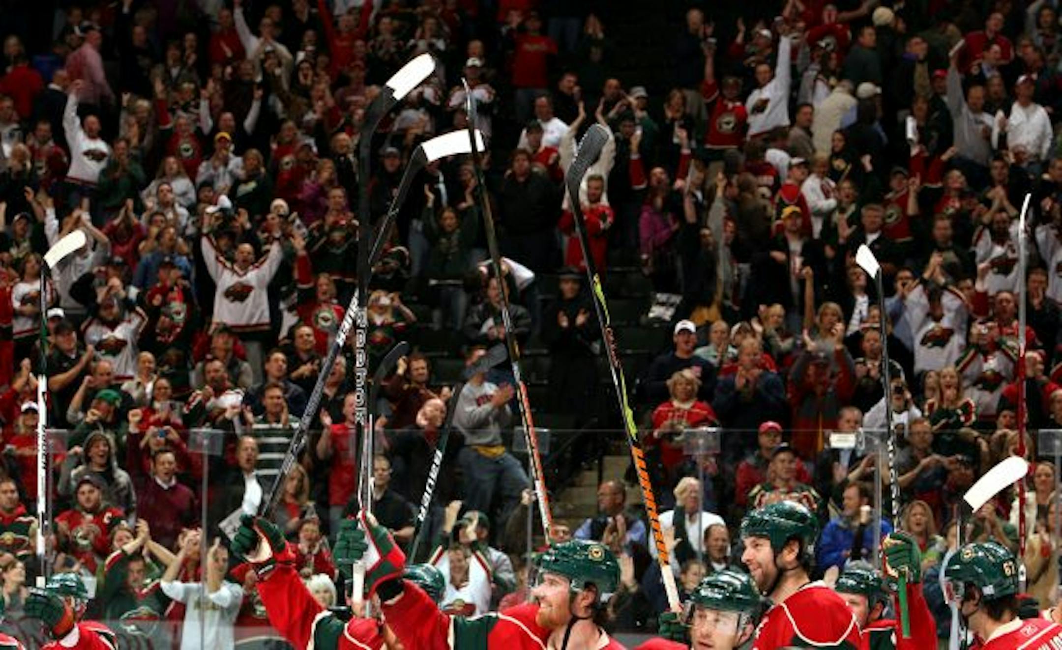 Minnesota Wild fans cheered for the team at the end of a game in 2009.