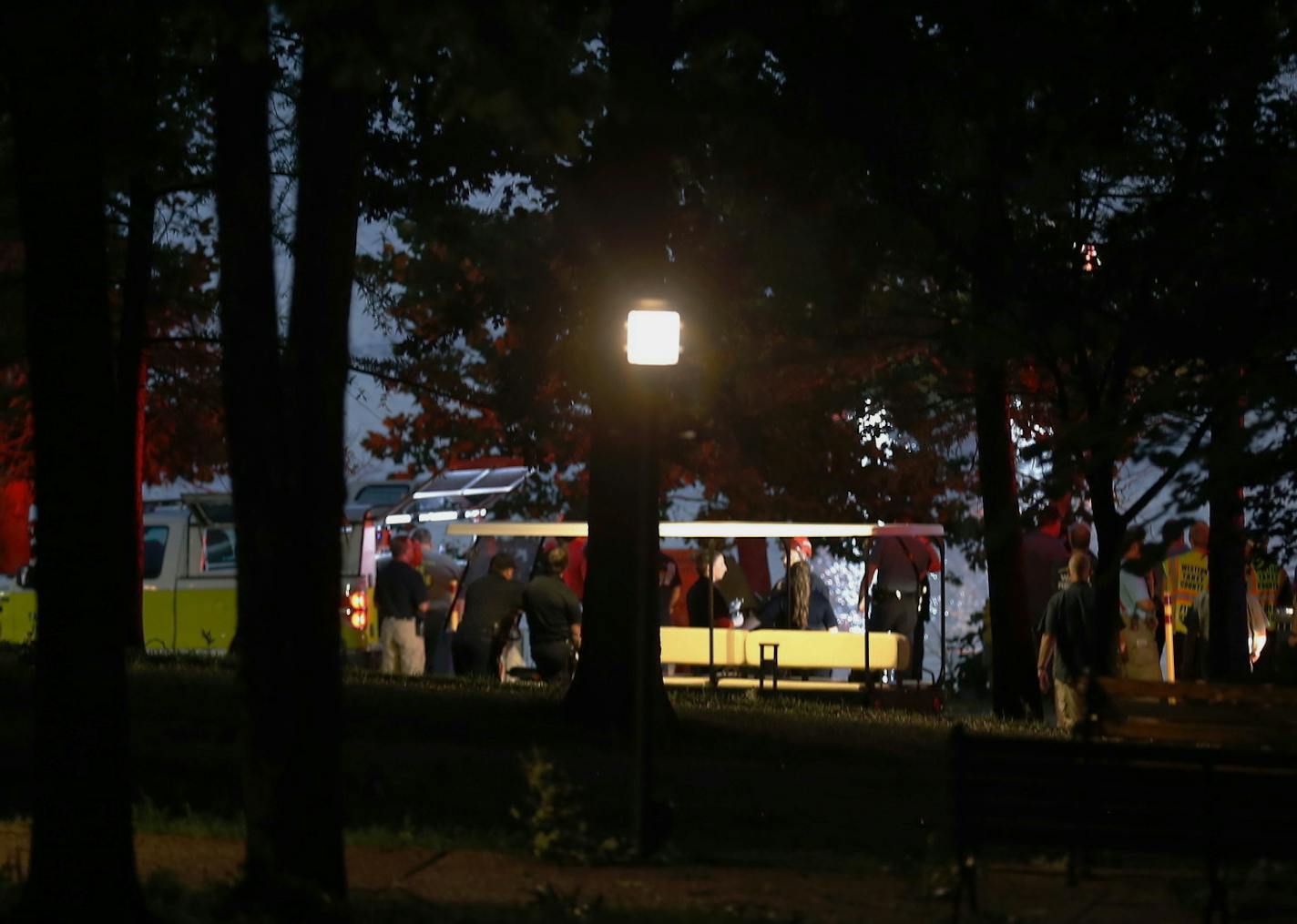 Emergency responders work at Table Rock Lake after a deadly boat accident in Branson, Mo., Thursday, July 19, 2018. A sheriff in Missouri said a tourist boat has apparently capsized on the lake, leaving several people dead and several others hospitalized. (Nathan Papes/The Springfield News-Leader via AP)