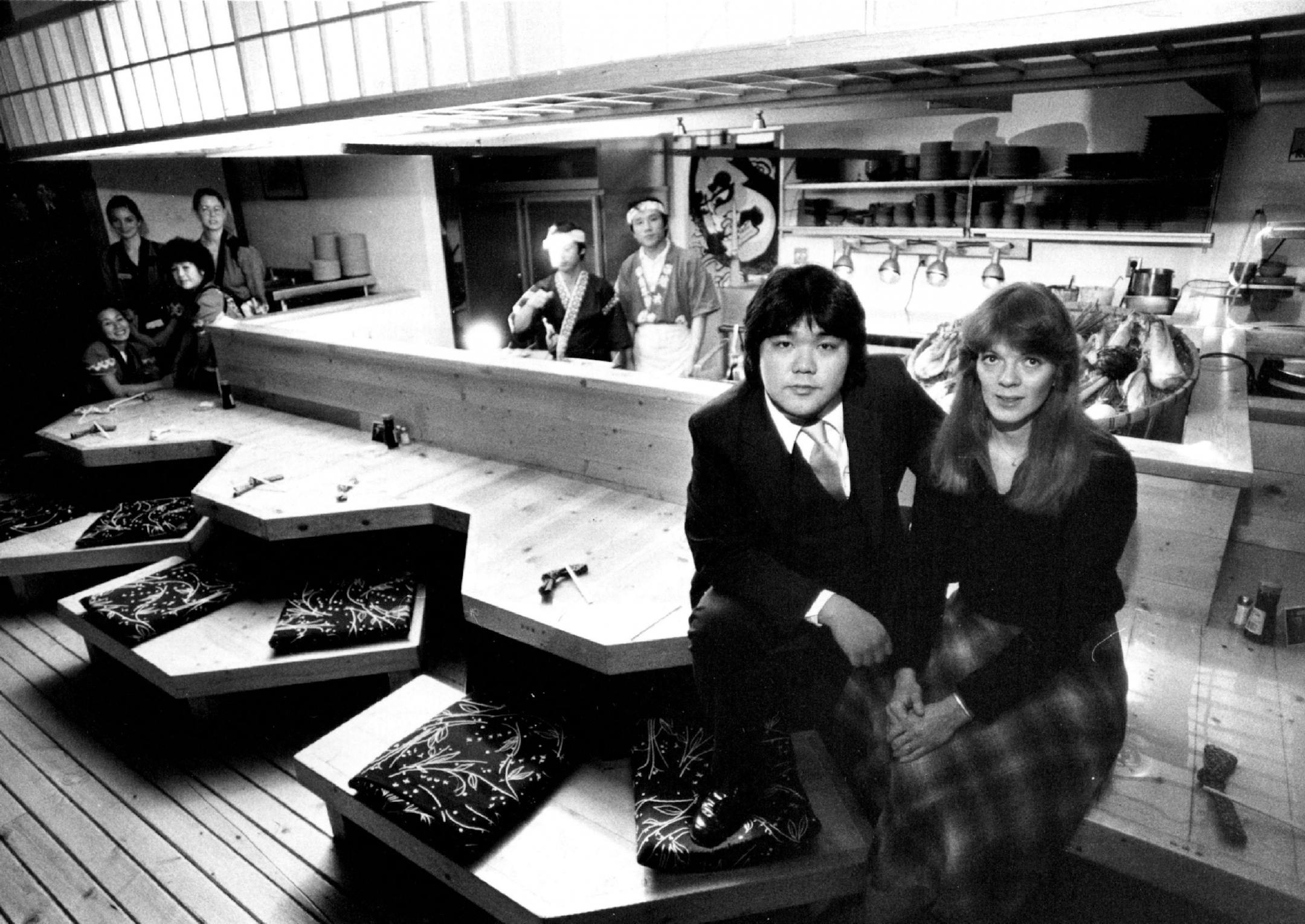November 28, 1980 Owner Tatsuya Saji and his wife, Joyce, at the Saji-Ya restaurant in St. Paul Robata, which in Japanese means open fire, is a method of cooking food on skewers around a communal hearth. A medieval rural cooking style, it is native to Hokkaido, Japan's northernmost island. A rustic cuisine, it is heartier and less stylized than the daintier and more familiar cuisine of Tokyo and its environs. Saji-Ya, 695 Grand Ave., St. Paul, is a robata-style restaurant. True to character, it