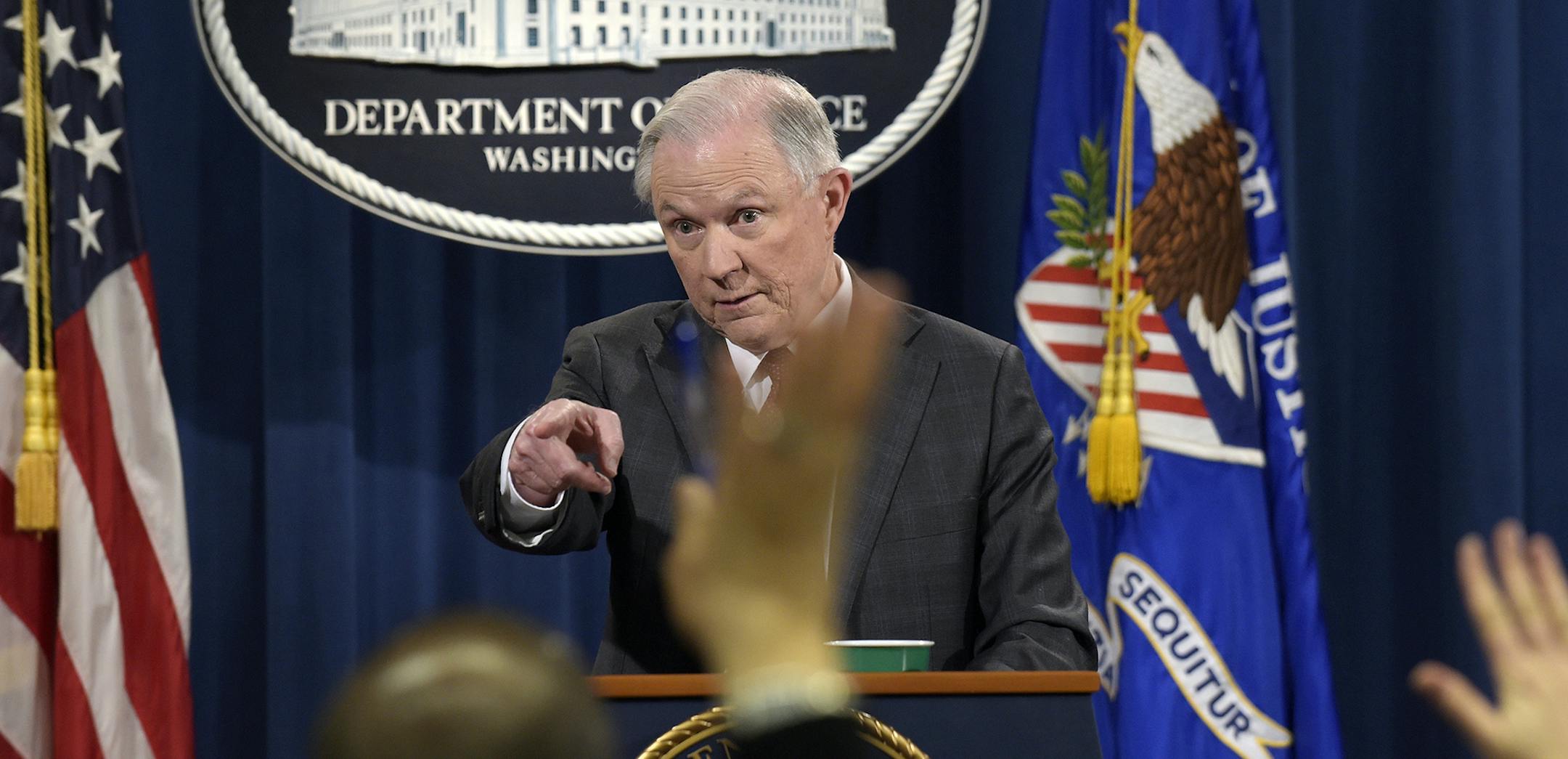 Attorney General Jeff Sessions calls on a reporter during a news conference at the Justice Department in Washington, Thursday, March 2, 2017. Sessions said he will recuse himself from a federal investigation into Russian interference in the 2016 White House election.(AP Photo/Susan Walsh) ORG XMIT: MIN2017030215460541