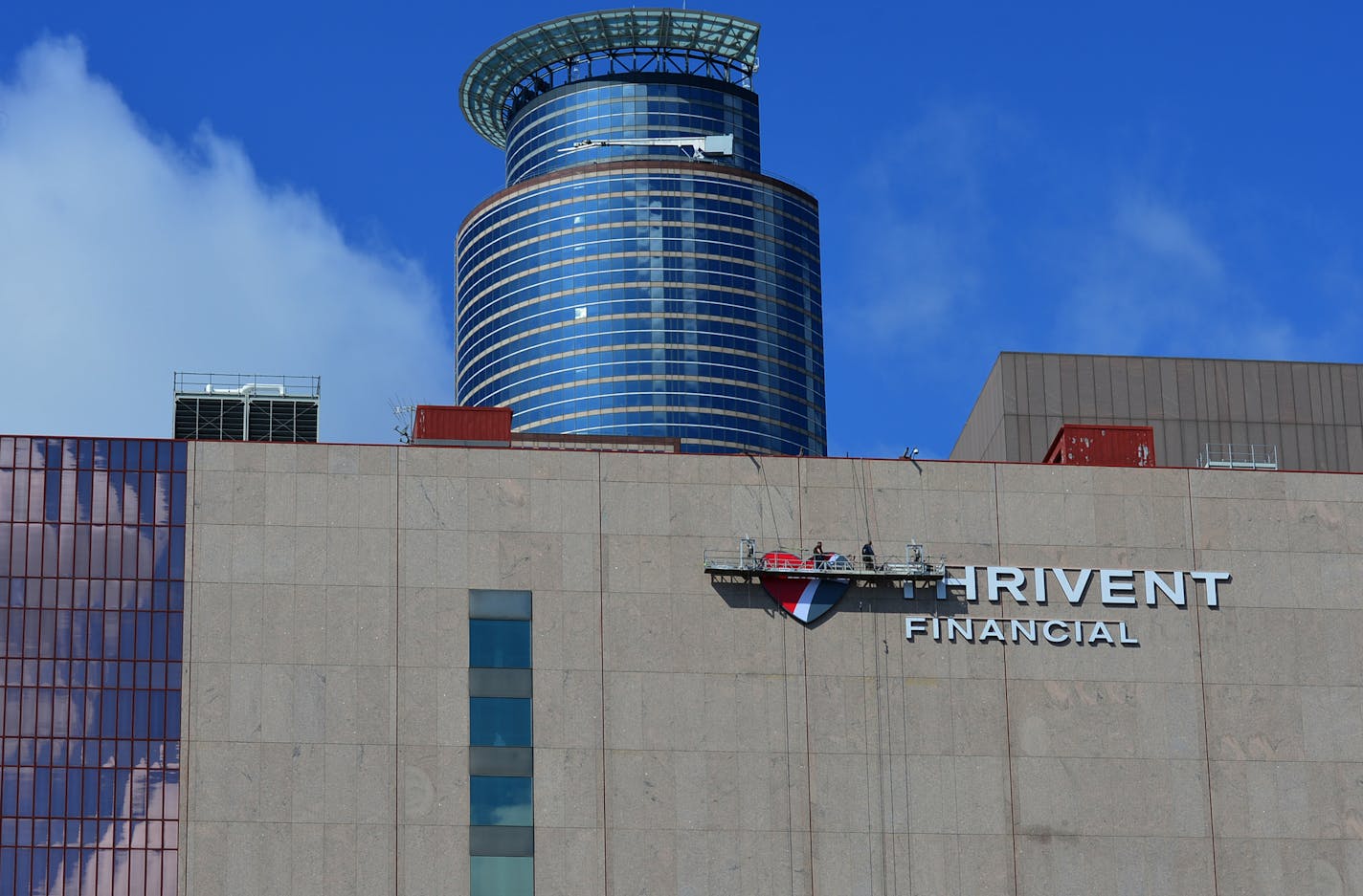 Workers started the process of installing the new heart emblem on their building in downtown Minneapolis, as part of the new branding campaign.. ] Thrivent brand changes beginning March 3, they are putting p a new large "heart" emblem on their building as part of the new branding campaign.. Thrivent has refreshed its brand to better express the story of the organization and to help more Christians feel welcome. This change is a natural next step following the membership vote to extend the common