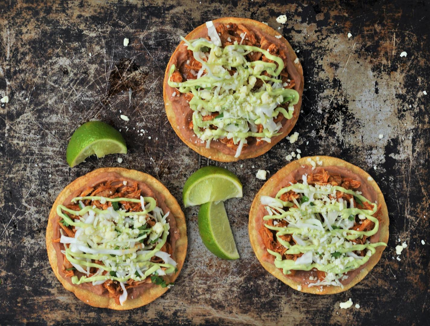 Turn Taco Tuesday into Tostada Tuesday with Chicken Tinga Tostadas with Avocado Crema. Photo and recipe by Meredith Deeds, Special to the Star Tribune.