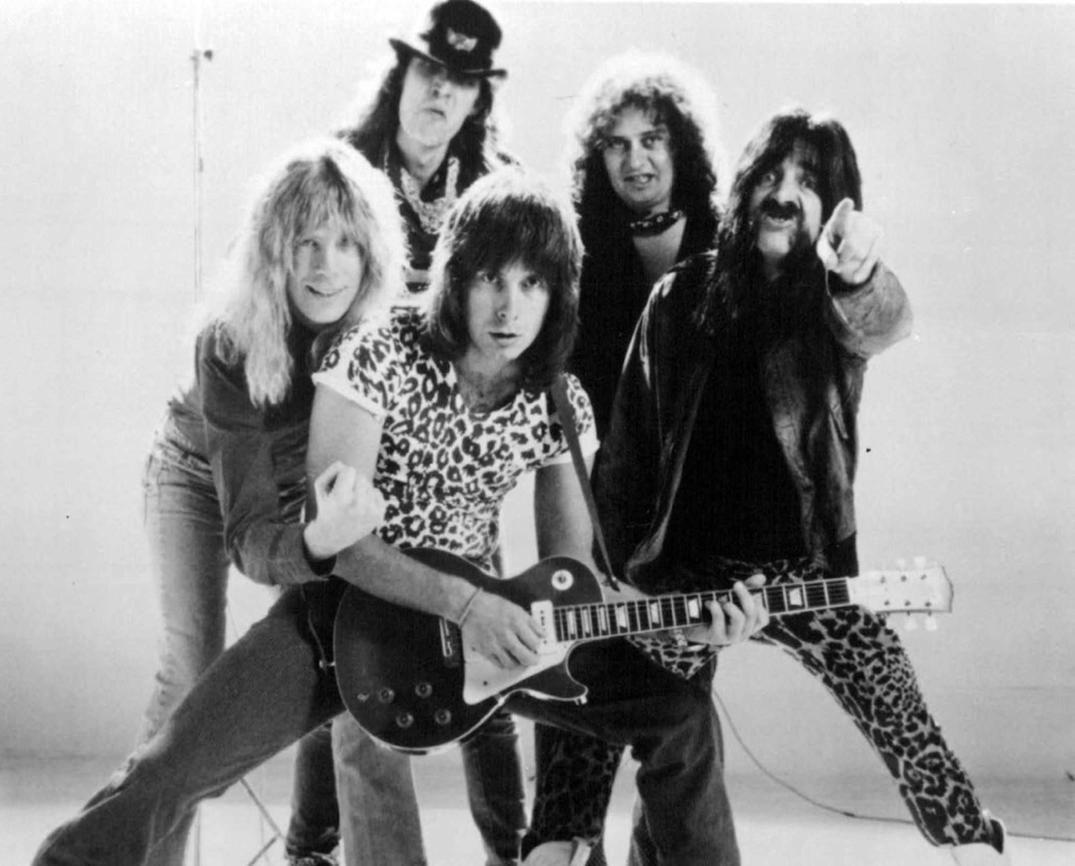 Spinal Tap (left to right): lead vocalist David St. Hubbins (Michael Mckean), drummer Mick Shrimpton (R.J. Parnell), (center) co-lead guitarist Nigel Tufnel (Christopher Guest), keyboardist Viv Savage (David Kaff ) and bassist Derek Smalls (Harry Shearer).
