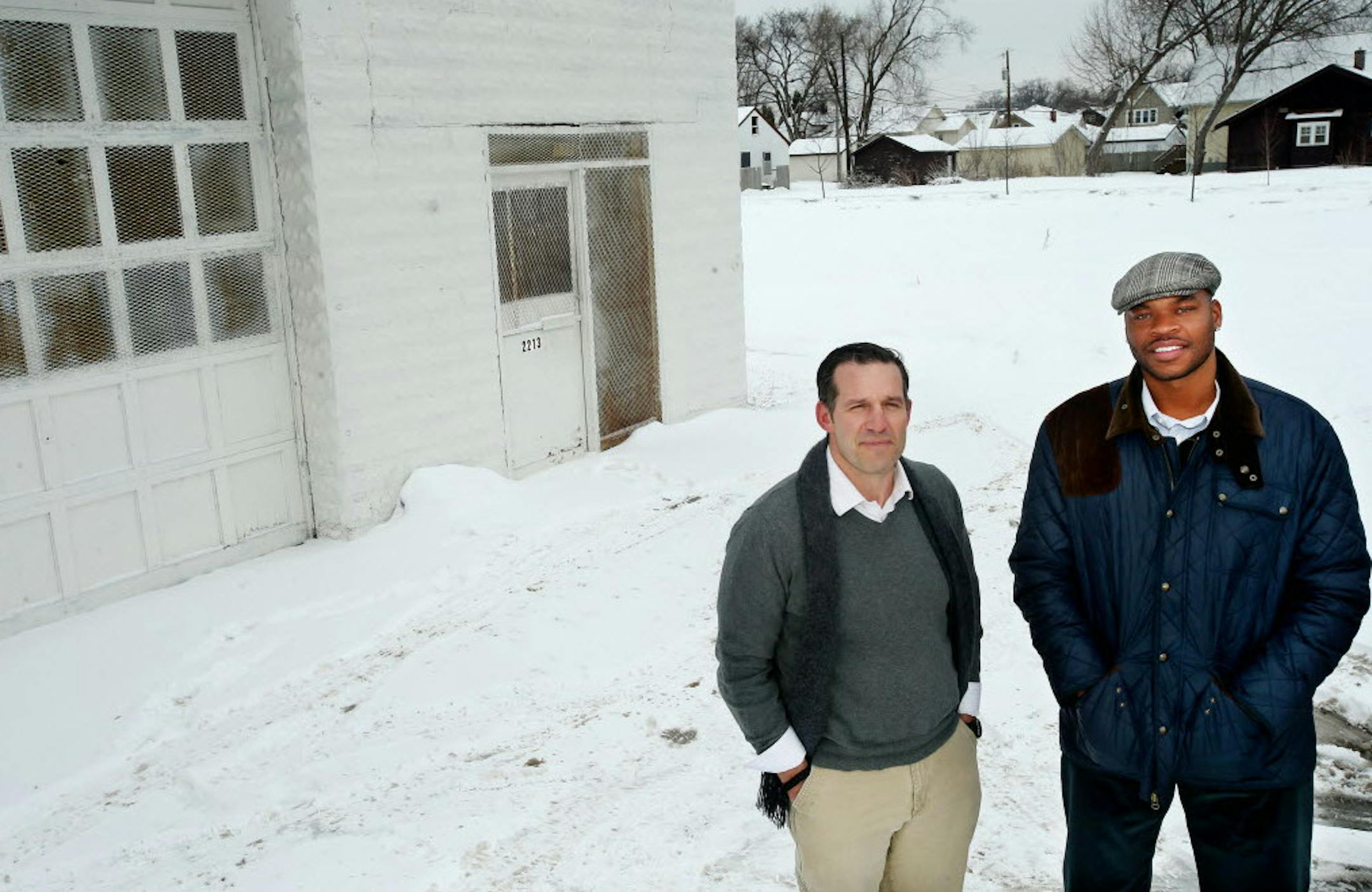 Jeff Washburne of City of Lakes Community Land Trust and developer Devean George on an abandoned North Minneapolis site that will be developed this summer into a housing-retail complex at Penn Avenue and Golden Valley Road, a couple blocks from George's childhood home.