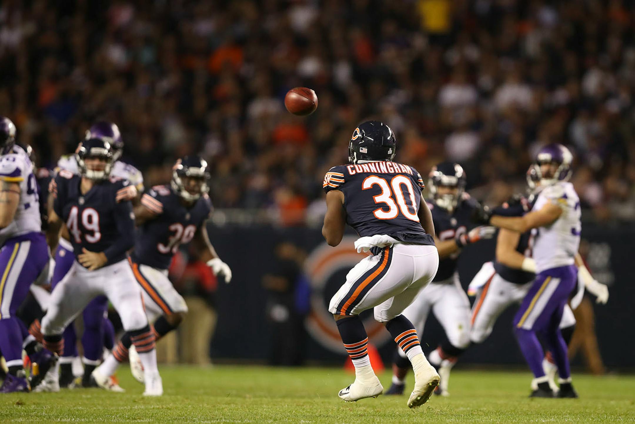 Chicago Bears running back Benny Cunningham (30) caught a pass from Chicago Bears punter Pat O'Donnell on a trick play that resulted in a 38 yard touchdown play in the third quarter.