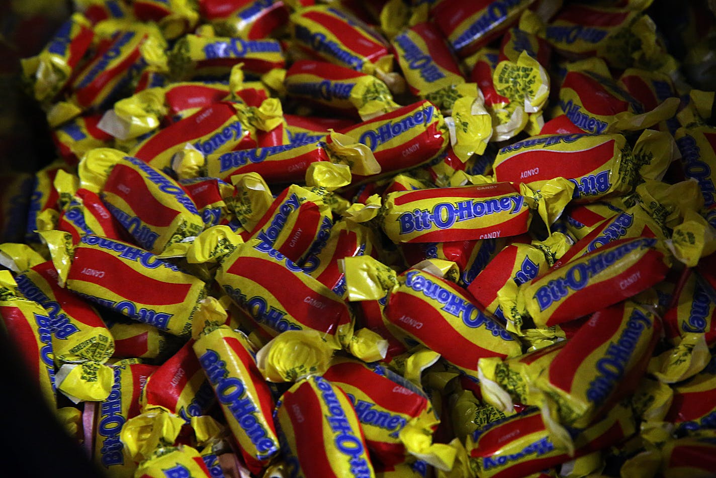 Bit-O-Honey candies were prepared for packaging at the Pearson Candy Company factory in St. Paul. ] JIM GEHRZ &#x201a;&#xc4;&#xa2; jgehrz@startribune.com / St. Paul, MN / March 26, 2014 / 11:00 AM / BACKGROUND INFORMATION: Bit-O-Honey candy has been around for 90 years, but it's never been made in Minnesota - until today. With a flip of the switch, St. Paul Mayor Chris Coleman opened a new era at Pearson Candy Co., which has been around since 1909, on Wednesday, starting the new assembly line.