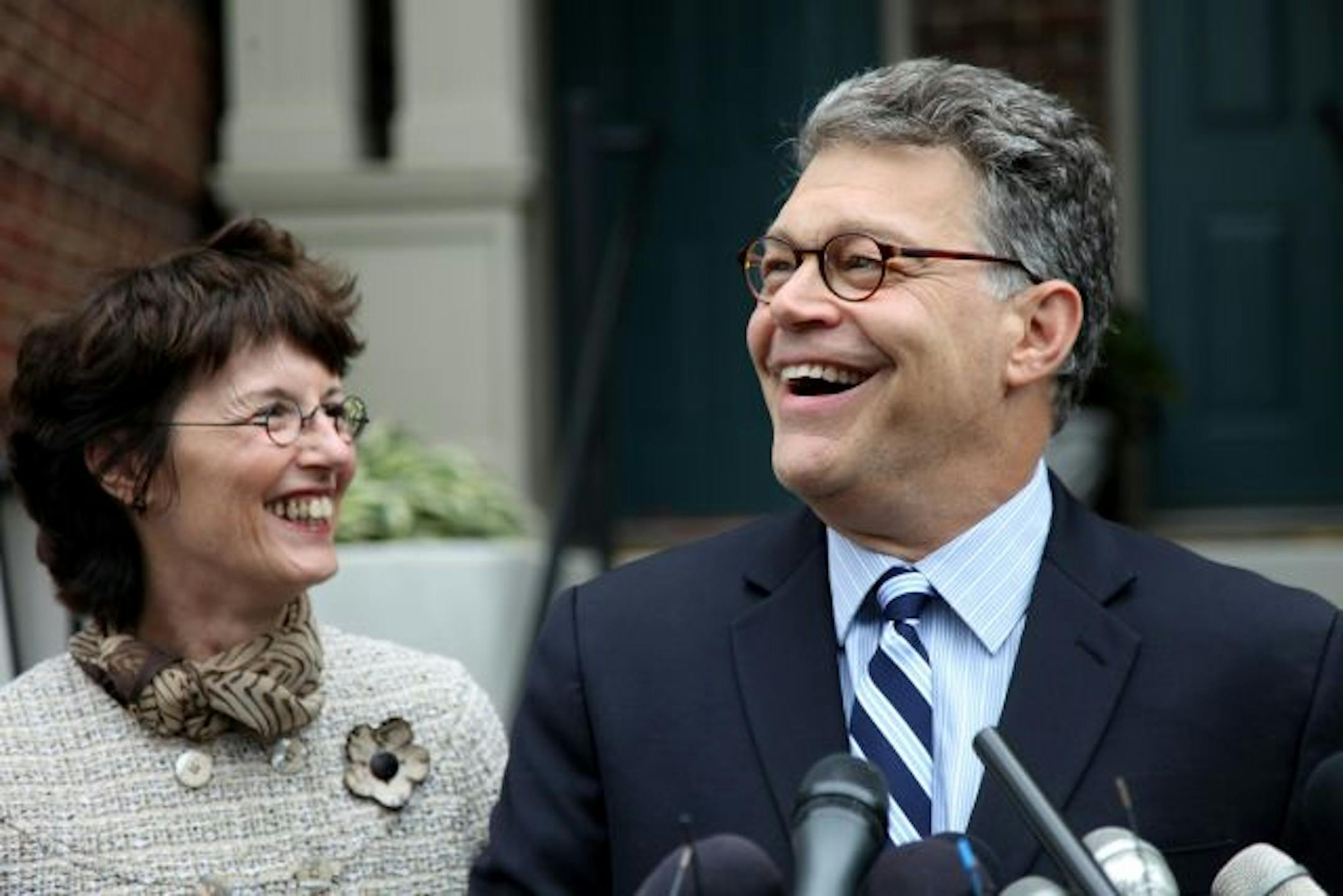 Al Franken and his wife, Franni, outside their Minneapolis home Tuesday following the 5-0 decision by the Minnesota Supreme Court declaring him the winner.