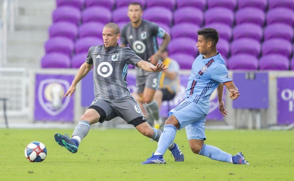 Minnesota United FC's Ozzie Alonso (6) fights for a loose ball during the first half of an MLS soccer friendly match against New York City FC on Feb. 