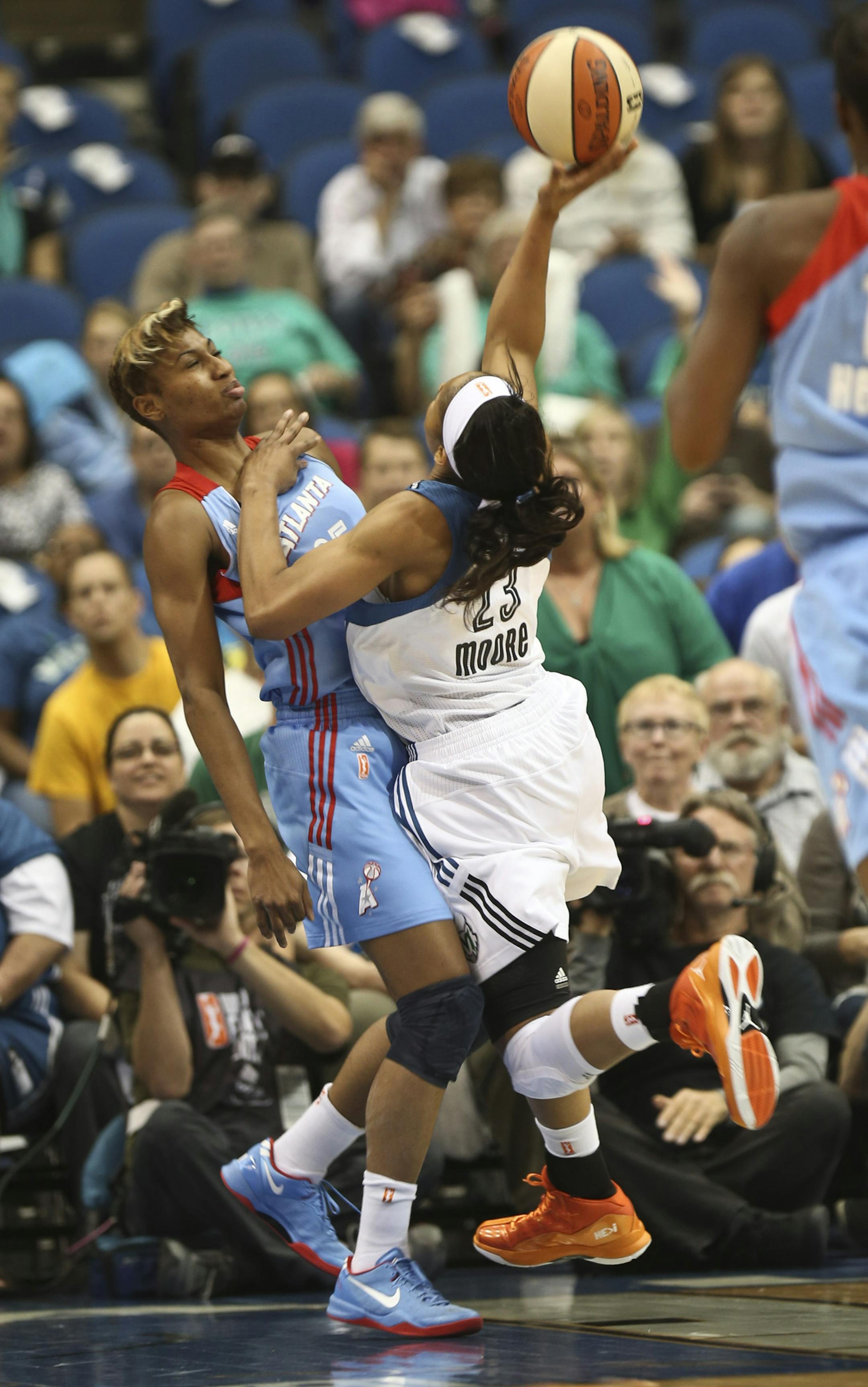 Maya Moore slammed into Angel McCoughtry