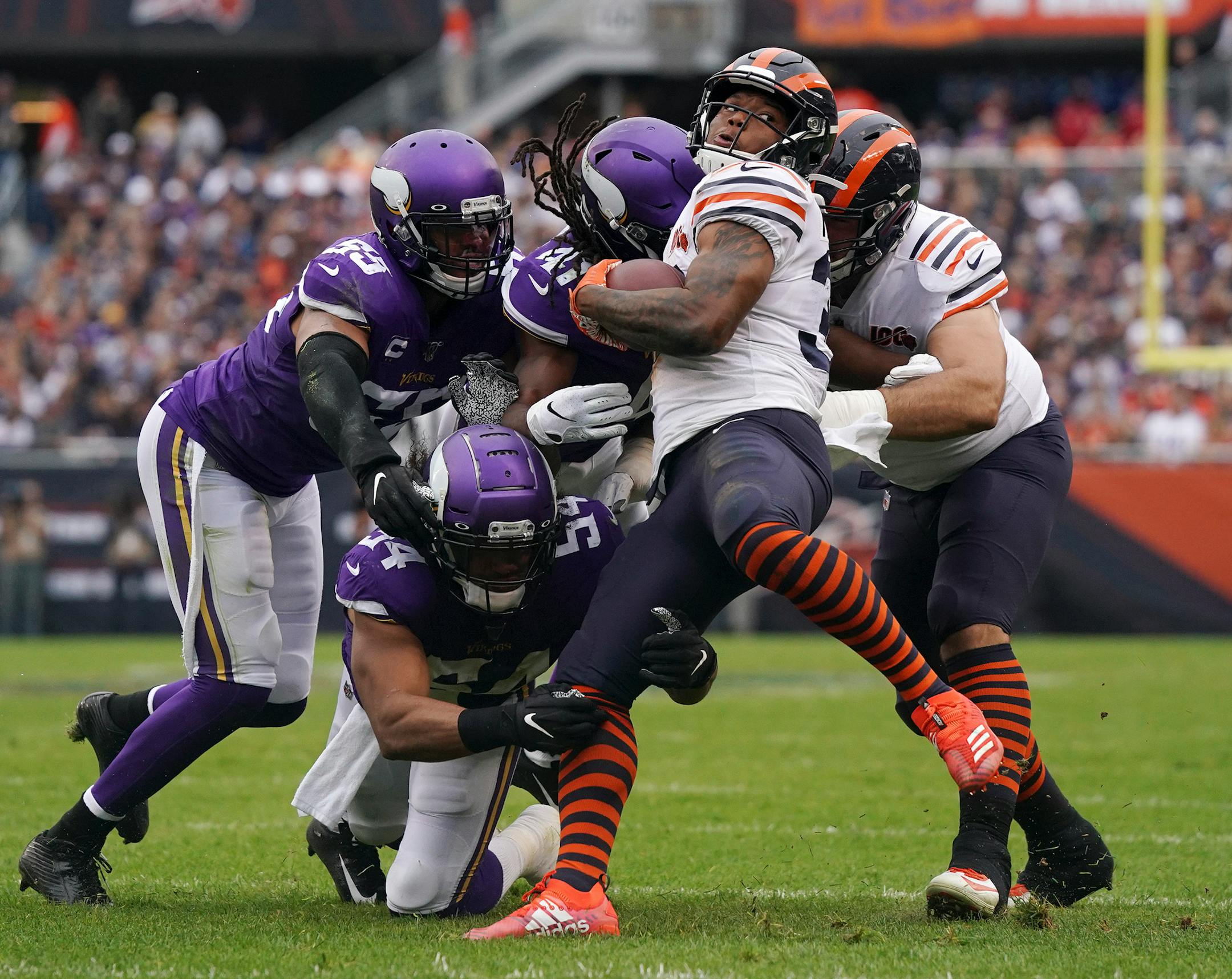Chicago Bears running back David Montgomery (32) was brought down by Minnesota Vikings middle linebacker Eric Kendricks (54) and defensive back Anthony Harris (41) in the first quarter. ] ANTHONY SOUFFLE • anthony.souffle@startribune.com The Minnesota Vikings played the Chicago Bears in an NFL football game Sunday, Sept. 29, 2019 at Soldier Field in Chicago.