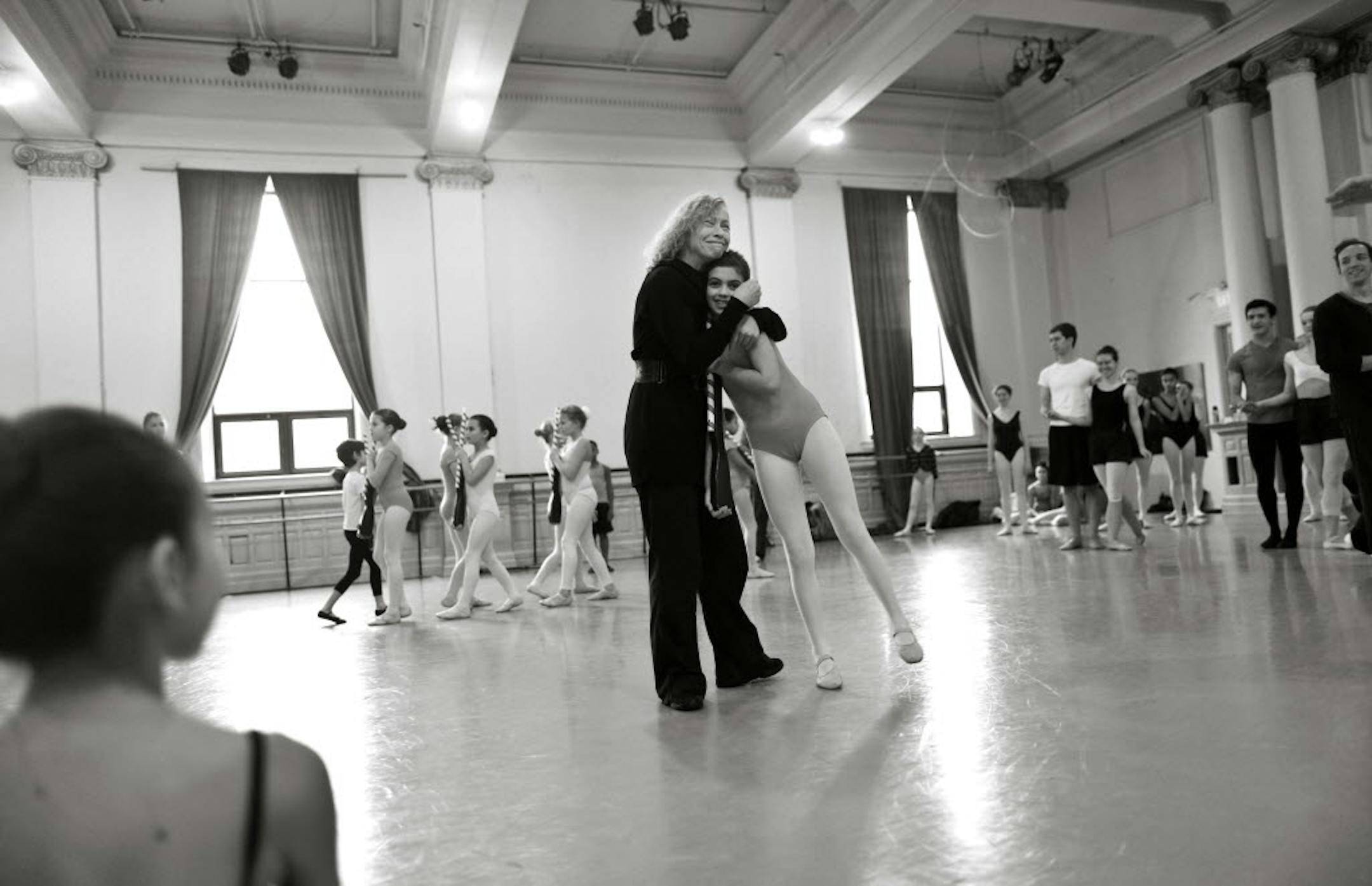 Lise Houlton, director of Minnesota Dance Theatre, hugged dance student Rita Tsapatsis during rehearsal for "Loyce Houlton's Nutcracker Fantasy," the holiday ballet created by her mother in 1964. The production uses 98 performers and includes six levels of students, beginning with wee "Mice," as well as a cast of professional dancers.