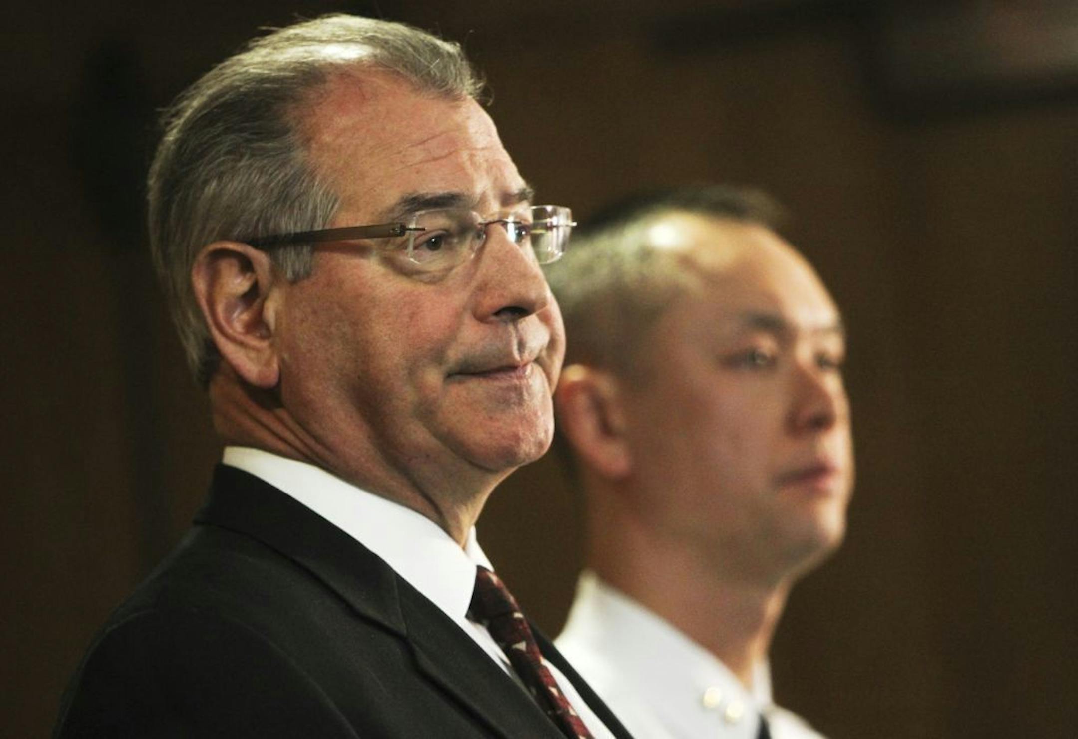 Hennepin County Attorney Mike Freeman, above left, and Assistant Police Chief Matt Clark discussed the charges filed against Kao Xiong on Thursday in the accidental shooting death of his 2-year-old son, Neegnco, left. Freeman said it was premature to predict whether Xiong might go to prison.