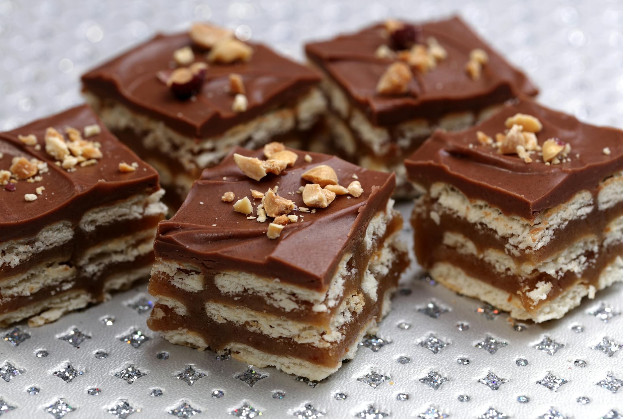 Kit Kat Christmas Bars (from baker Julie Olson) ] The winner and four finalists in the 2015 Taste Holiday Cookie (Cooky) Contest: Chocolate Decadence Cookies (from baker Elaine Prebonich), Kit Kat Christmas Bars (from baker Julie Olson), Cardamom Orange Zest Sugar Cookies (from baker Jeanne Nordstrom), Bacon Cornmeal Venetos (by bakers Julie Bollmann, Wendy Kleiser, Joan Koller, Geri Olson and Mary Urbas) and winner Apple Cardamom Pecan Star Cookies (from baker Jana Freiband).