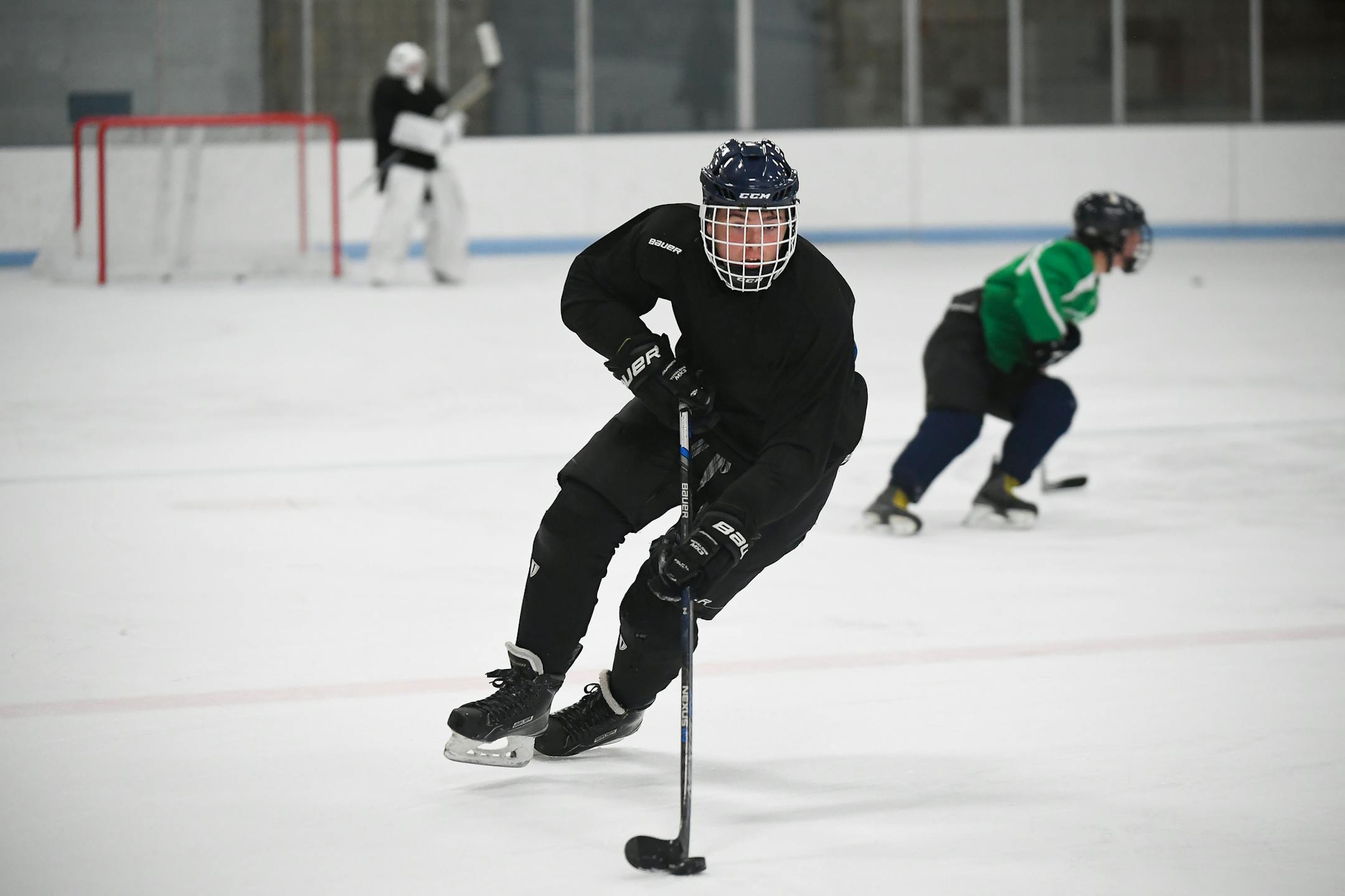 Totino Grace freshman Luke Rooker controlled the puck during hockey practice Wednesday. ] AARON LAVINSKY &#x2022; aaron.lavinsky@startribune.com The professionalization of youth sports, for top players as well as those just aspiring for a varsity spot, has irrevocably changed the experience at the high school level. Families are making investments with their time and money, just to keep up. Despite kids being better-prepared than any generation before them, many coaches and experts fear things h