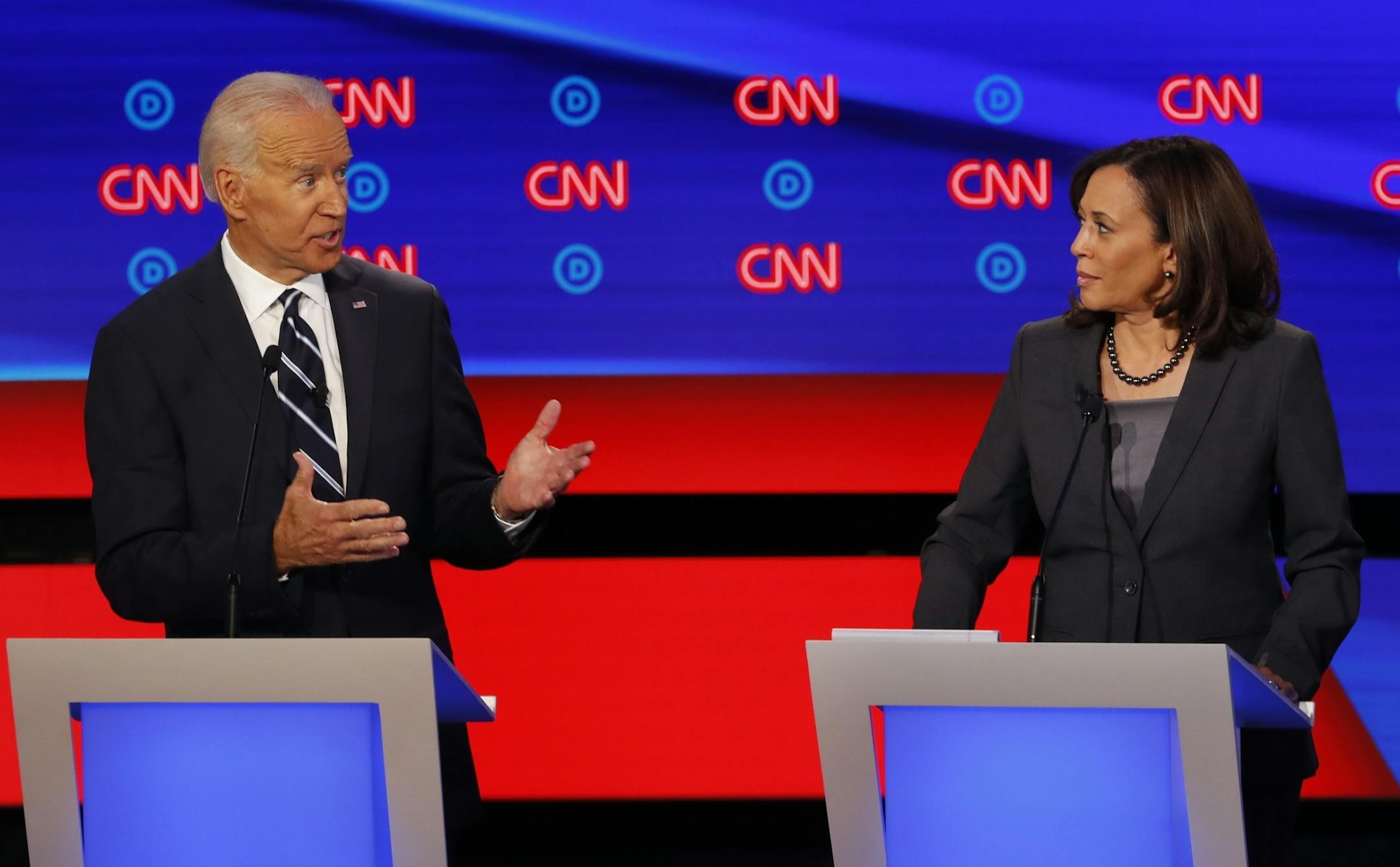 FILE - In this July 31, 2019, file photo, then-Democratic presidential candidate Sen. Kamala Harris, D-Calif., listens as Democratic presidential candidate former Vice President Joe Biden speaks during a Democratic presidential primary debate at the Fox Theatre in Detroit. Democratic presidential candidate former Vice President Joe Biden has chosen Harris as his running mate. (AP Photo/Paul Sancya, File)