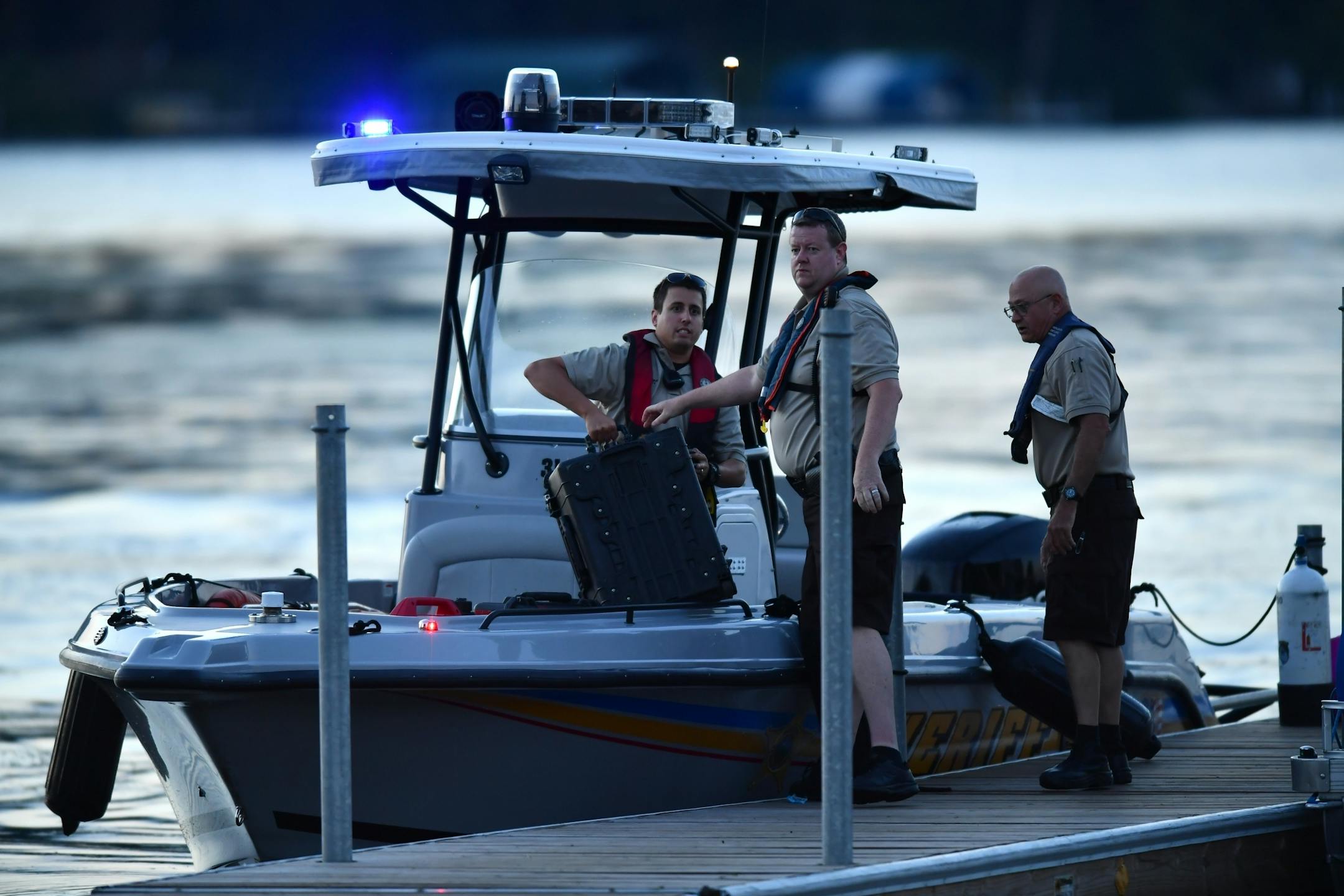 Hennepin County Sheriff's loaded equipment onto a search boat while responding to a drowning on Lake Minnetonka at Maxwell Bay Launch.