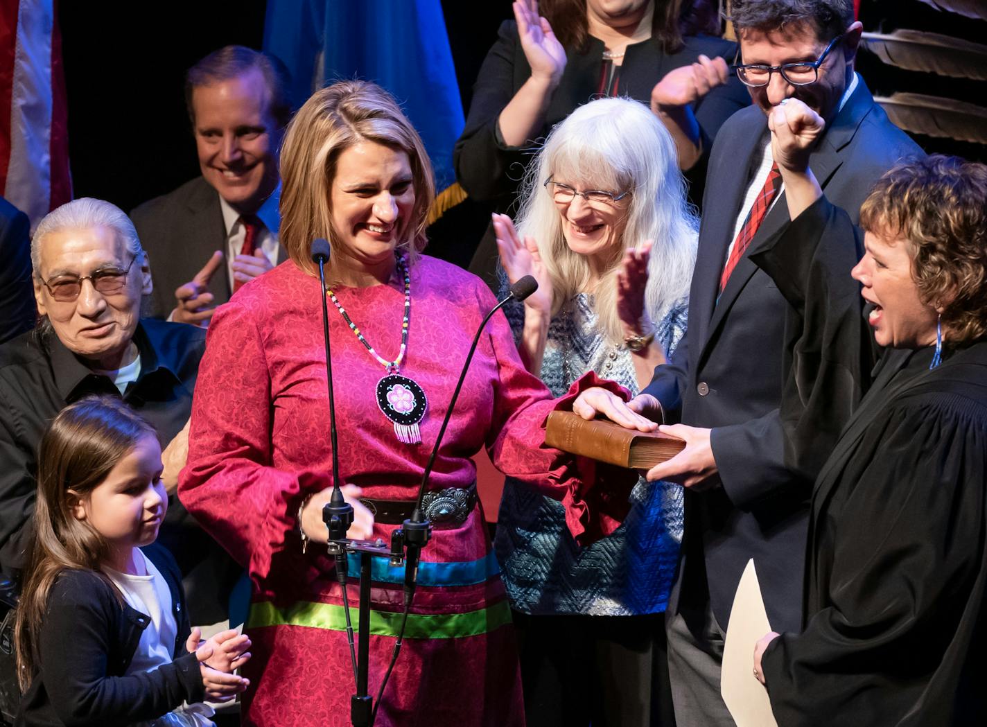 Associate Justice Anne McKeig pumped her fist in the air after swearing in Lt. Governor Peggy Flanagan. with her are her parents, daughter Siobhan Hellendrung, 5 and partner Tom Weber. ] GLEN STUBBE &#x2022; glen.stubbe@startribune.com Monday, January 7, 2019 Tim Walz will be sworn in as Minnesota's 41st governor, and constitutional officers Attorney General Keith Ellison, Secretary of State Steve Simon and State Auditor Julie Blaha will take their oaths of office as well.