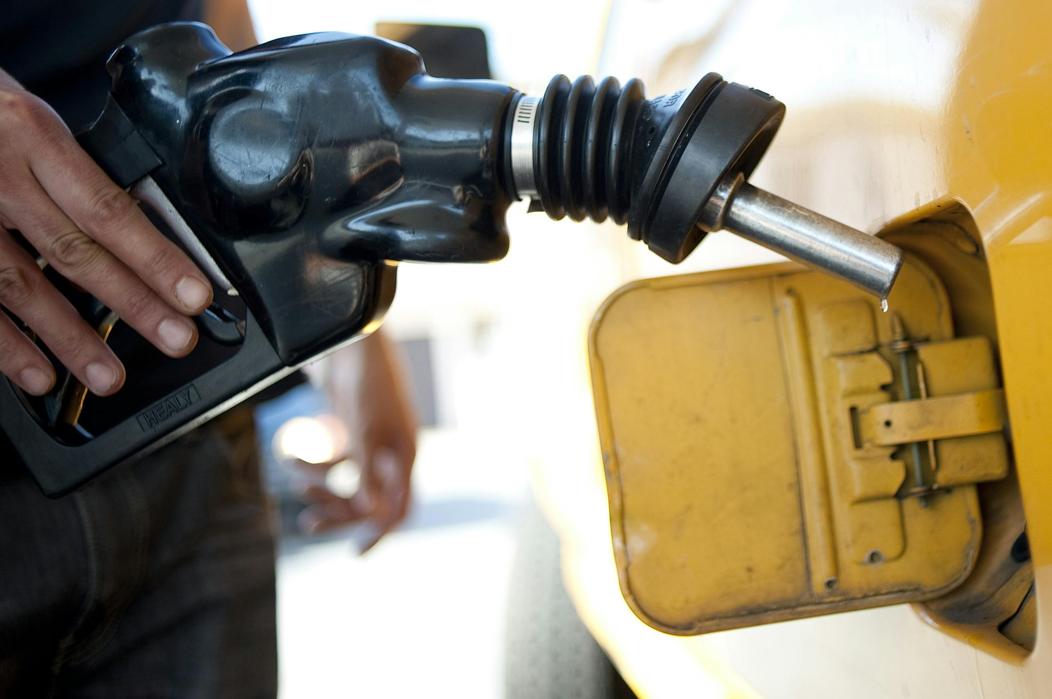 FILE - In this Aug. 10, 2012 file photo a customer pumps gas into his dual-tank pickup truck at a 76 gas station in Los Angeles. Environmental Protection Agency Administrator Scott Pruitt indicated this week he may target a longstanding federal waiver that allows California to set its own, tougher tailpipe emission standards, an exception that's allowed the state to prod the rest of nation to do more against air pollution and climate change for a half-century.