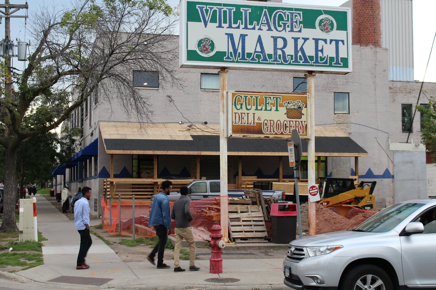 Village Market Mall on 24th Street and 10th Avenue South. The owner has built an unpermitted porch structure, and the city has ordered work there to stop.