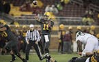 Minnesota's quarterback Demry Croft passed the ball to wide receiver Tyler Johnson for a touchdown during the fourth quarter as the Gophers took on Mi