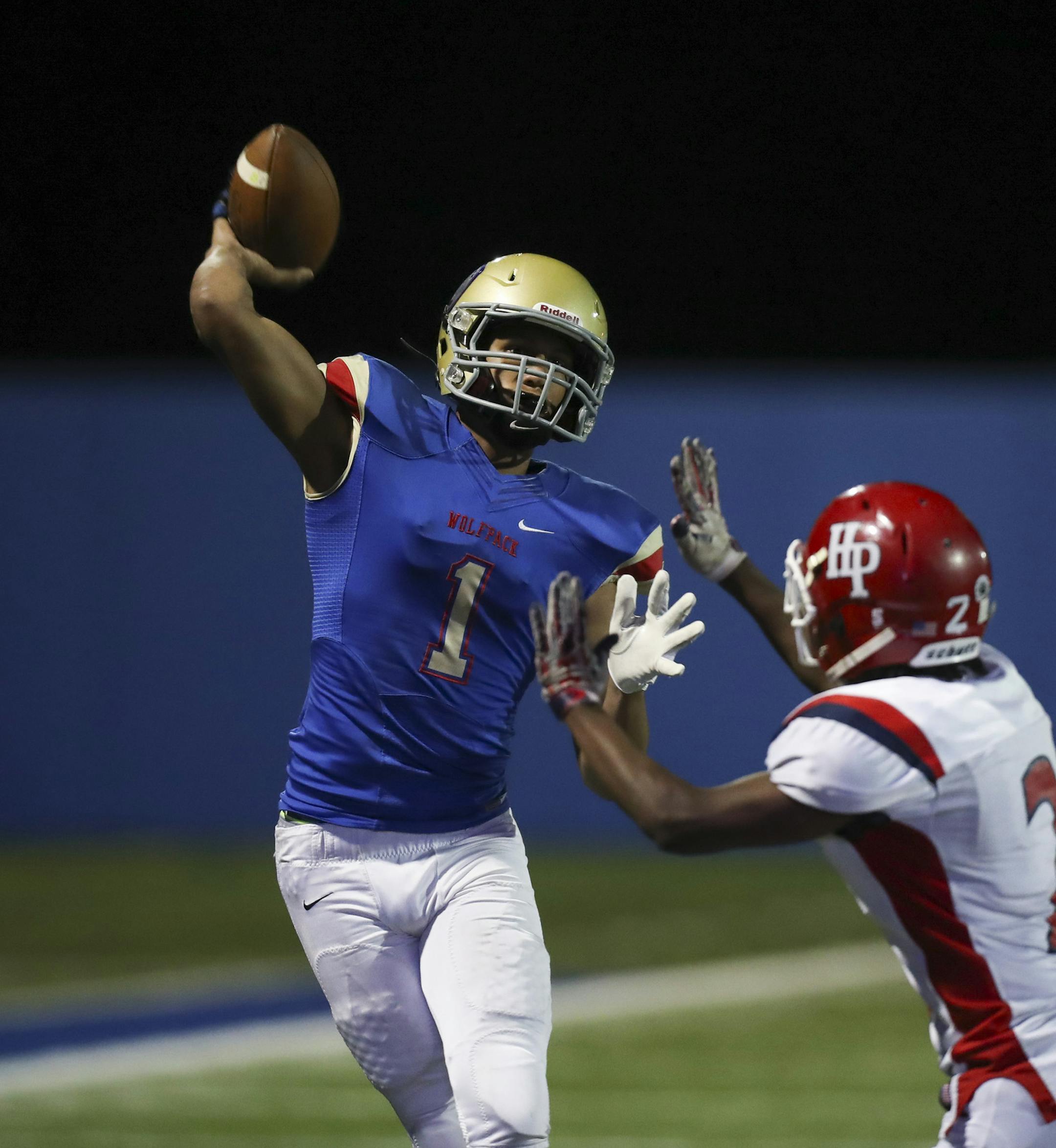 SMB quarterback Jalen Suggs released a fourth quarter pass under pressure from Highland Park's Abiyou Rose. ] JEFF WHEELER ï jeff.wheeler@startribune.com SMB beat Highland Park 42-19 in a football game Thursday night, September 28, 2017 at the Blake School in Hopkins. SMB is a cooperative program made up of players from Blake, Minnehaha Academy, and St. Paul Academy.
