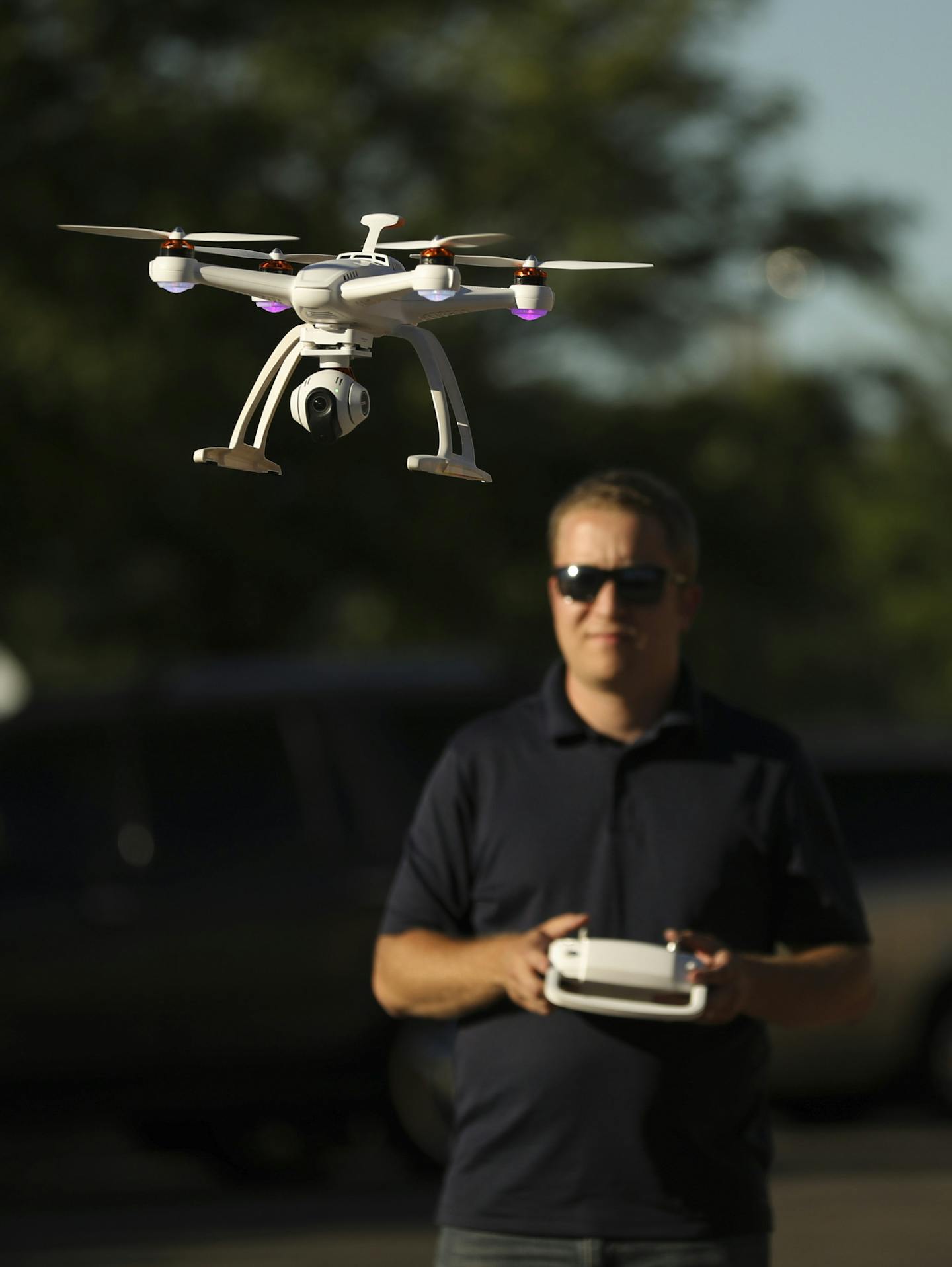 The drone piloted by Tyler Mason took off after a change of batteries while shooting footage in Robbinsdale for a film project. ] JEFF WHEELER &#xef; jeff.wheeler@startribune.com Tyler Mason, a drone operator with AirVuz, was working with Sean Skinner to shoot aerial footage of Robbinsdale Tuesday evening, July 12, 2016 for a film Skinner is making on the Terrace Theater.