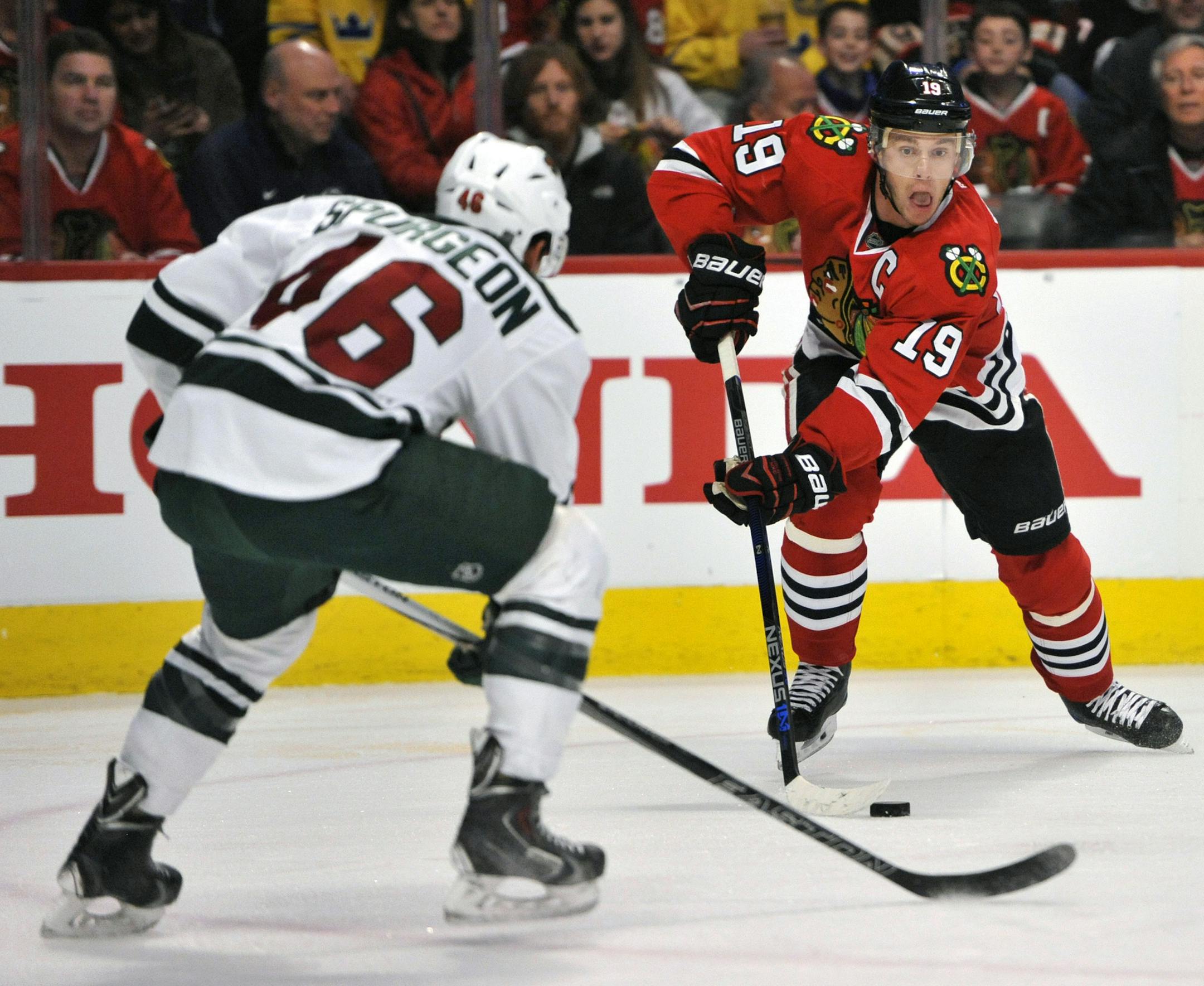 The Blackhawks' Jonathan Toews looked to shoot against the Wild's Jared Spurgeon during a March 20 game in Chicago.