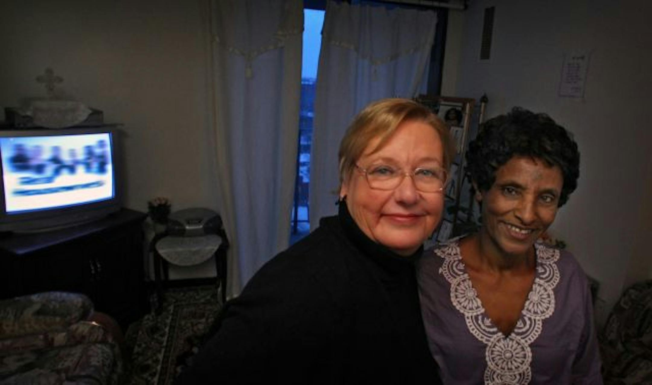 Fredda Schobey worked for years to help get Genet Habtemicael's two daughters out of Eritrea. The girls arrived on Christmas Day in 2009 and the two mothers have bonded like sisters.