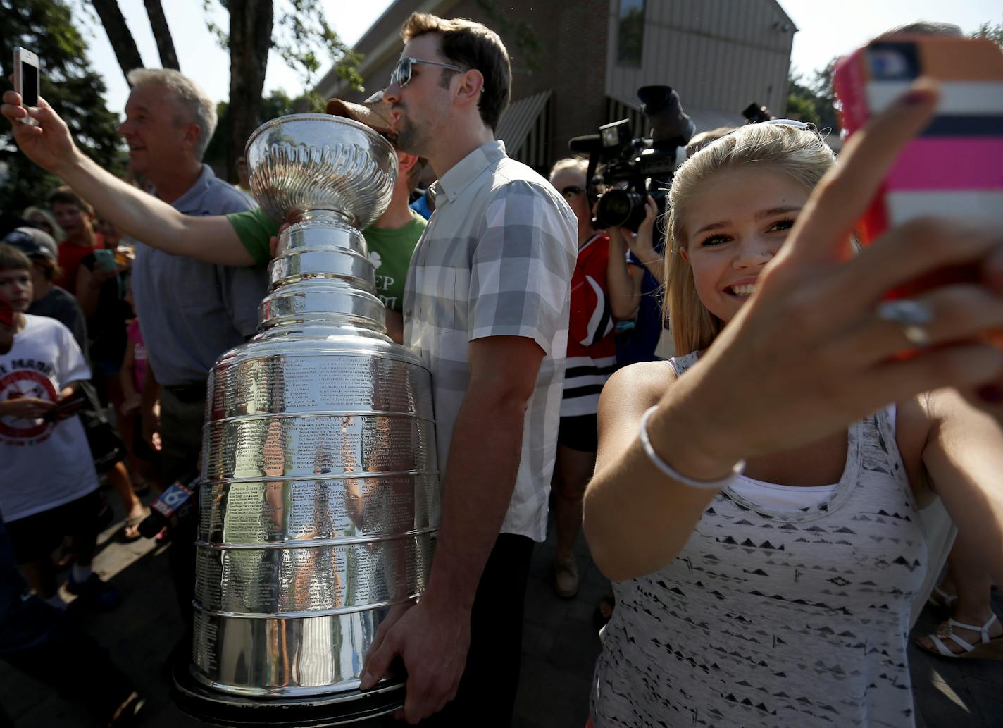 A young fan took a &#x201c;selfie&#x201d; as Nick Leddy of the Chicago Blackhawks passed by with the Stanley Cup at Maynard&#x2019;s in Excelsior on Thursday.