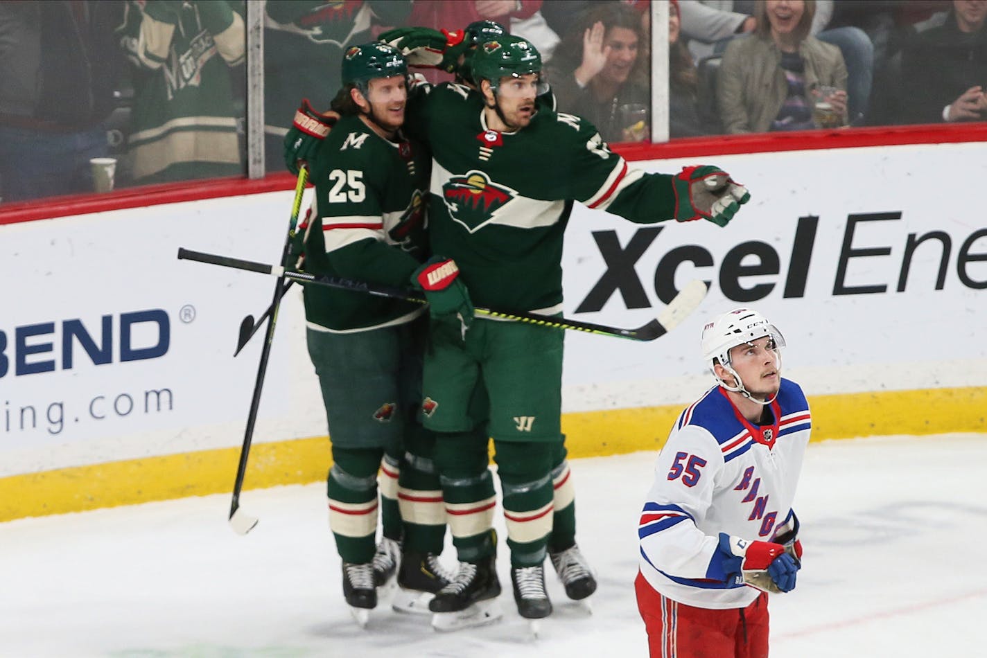 Minnesota Wild's Jonas Brodin,left, is congratulated by teammates after scoring against the New York Rangers during the first period of an NHL hockey game Thursday, Feb. 13, 2020, in St. Paul, Minn. Watching the scoreboard is Rangers' Ryan Lindgren. (AP Photo/Jim Mone)