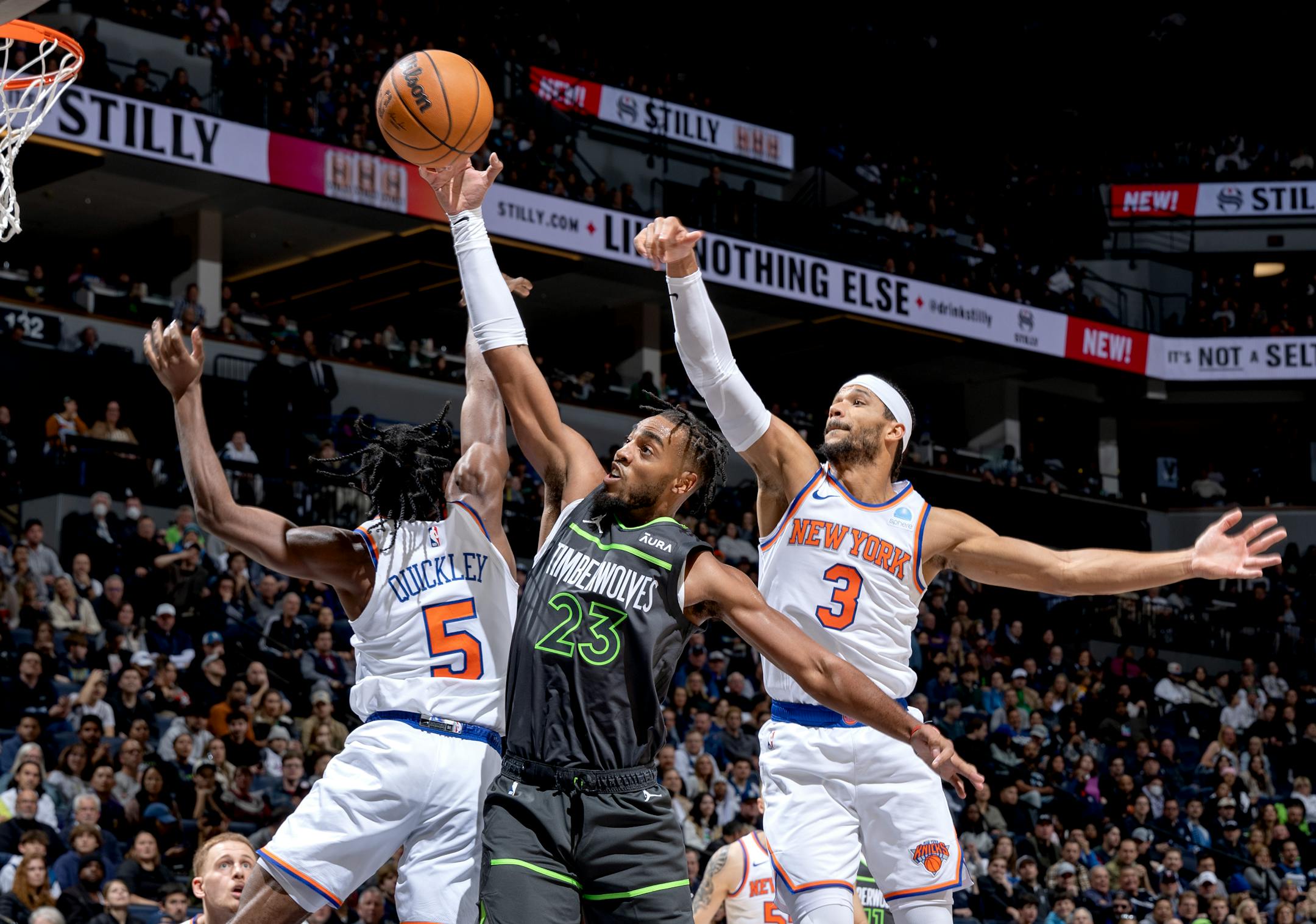 Troy Brown Jr. (23) of the Minnesota Timberwolves is defended by Immanuel Quickley (5) of the New York Knicks in the third quarter Monday, November 20, 2023, at Target Center in Minneapolis, Minn. ] CARLOS GONZALEZ • carlos.gonzalez@startribune.com