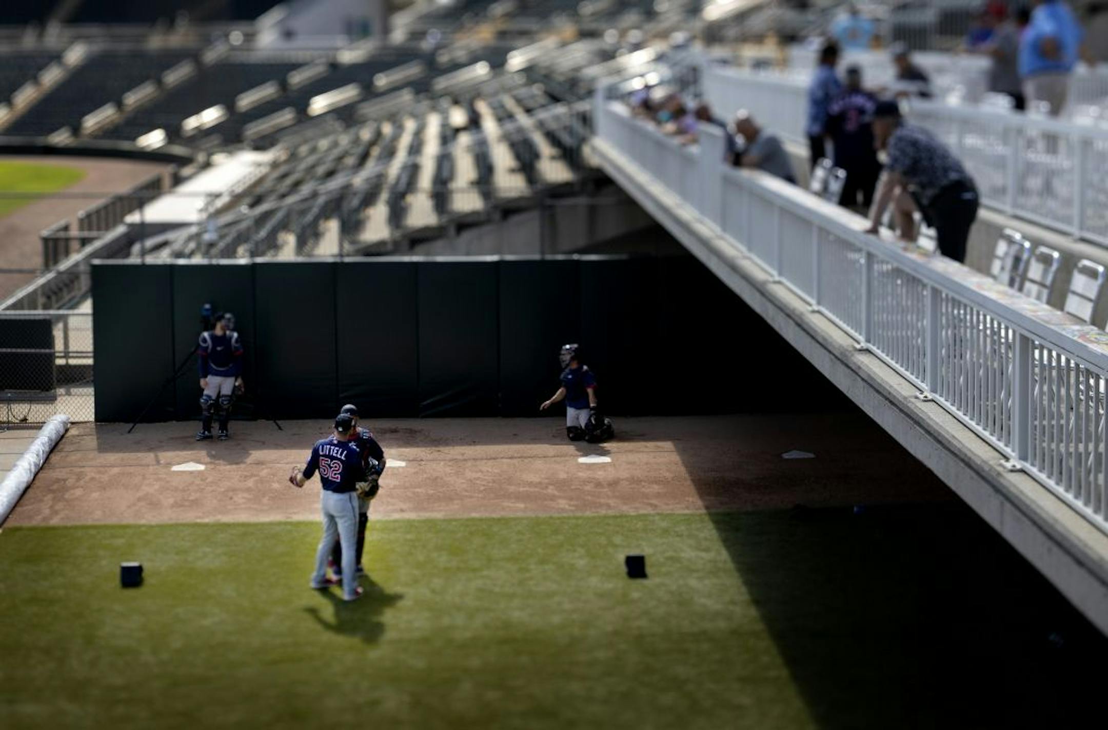 Minnesota Twins pitcher Zack Littell (52) talked to a catcher after throwing in the bullpen.
