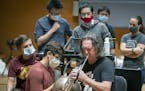 U Prof. Jiarong Hong, second from left, and U students tested aerosols as Michael Gast played.