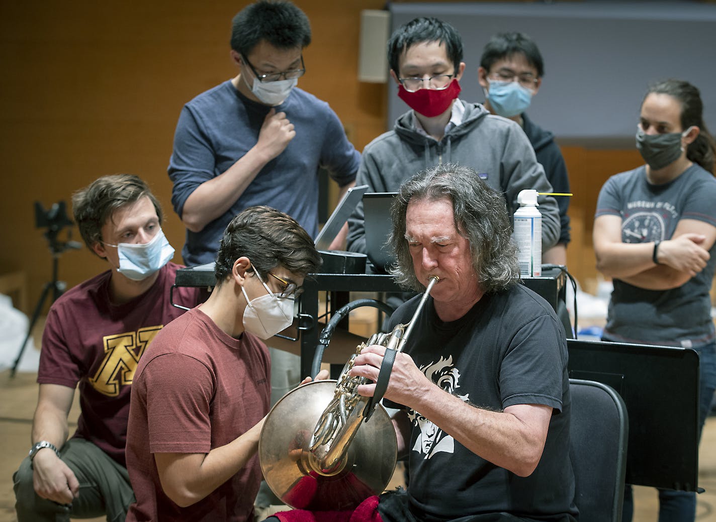 U Prof. Jiarong Hong, second from left, and U students tested aerosols as Michael Gast played.