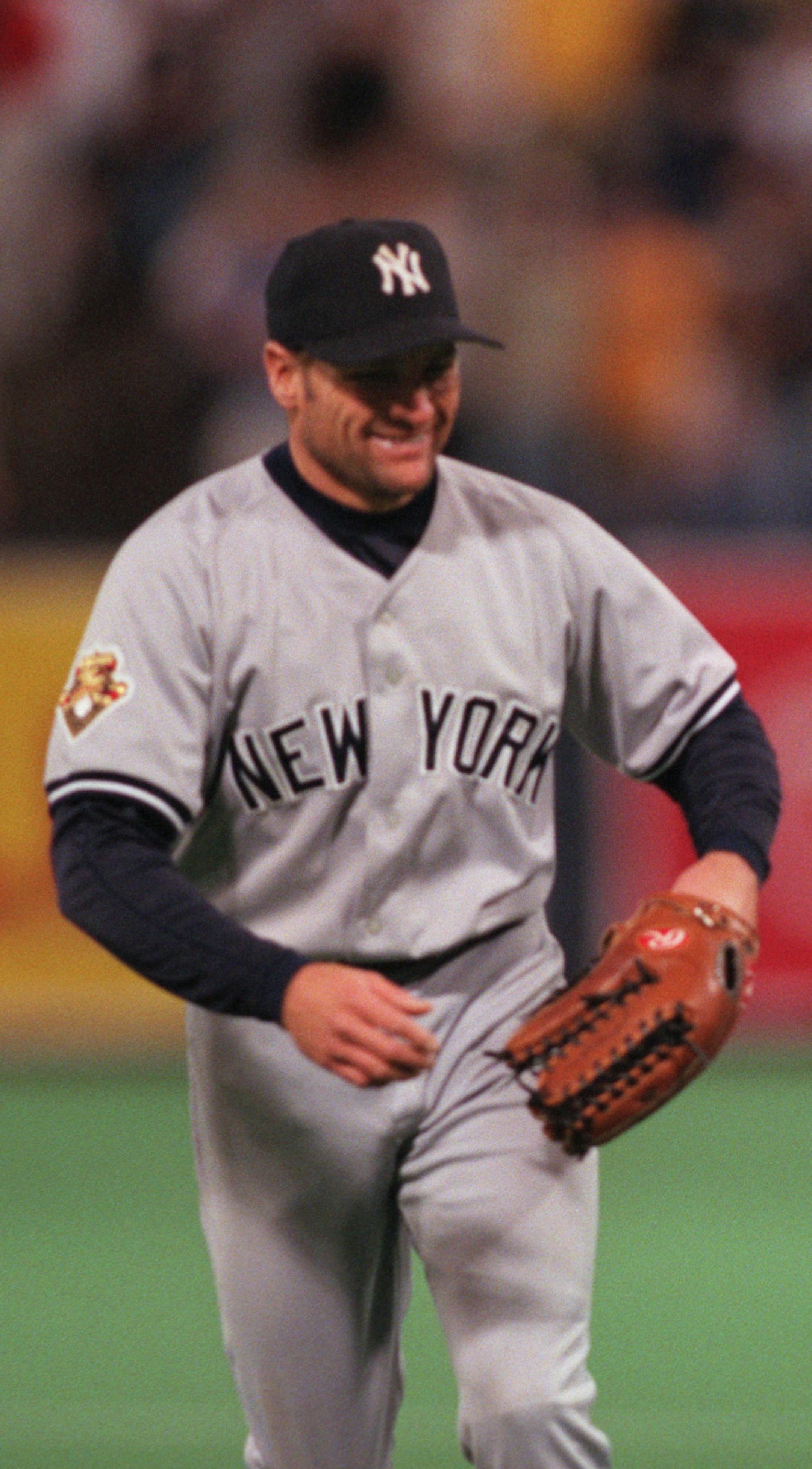 GENERAL INFORMATION: MINNEAPOLIS - 5/2/01 - In a game marred by delays, the Twins beat the Yankees 4 - 2 Wednesday night to take their three game series.
IN THIS PHOTO: After an eighth inning that saw a delay because of debris thrown at him in left field, Chuck Knoblauch managed a laugh after he and Matt Lawton spoke briefly when they crossed paths as Knoblauch left the field and the Twins headed out to begin the ninth inning. ORG XMIT: MIN2017021317314352